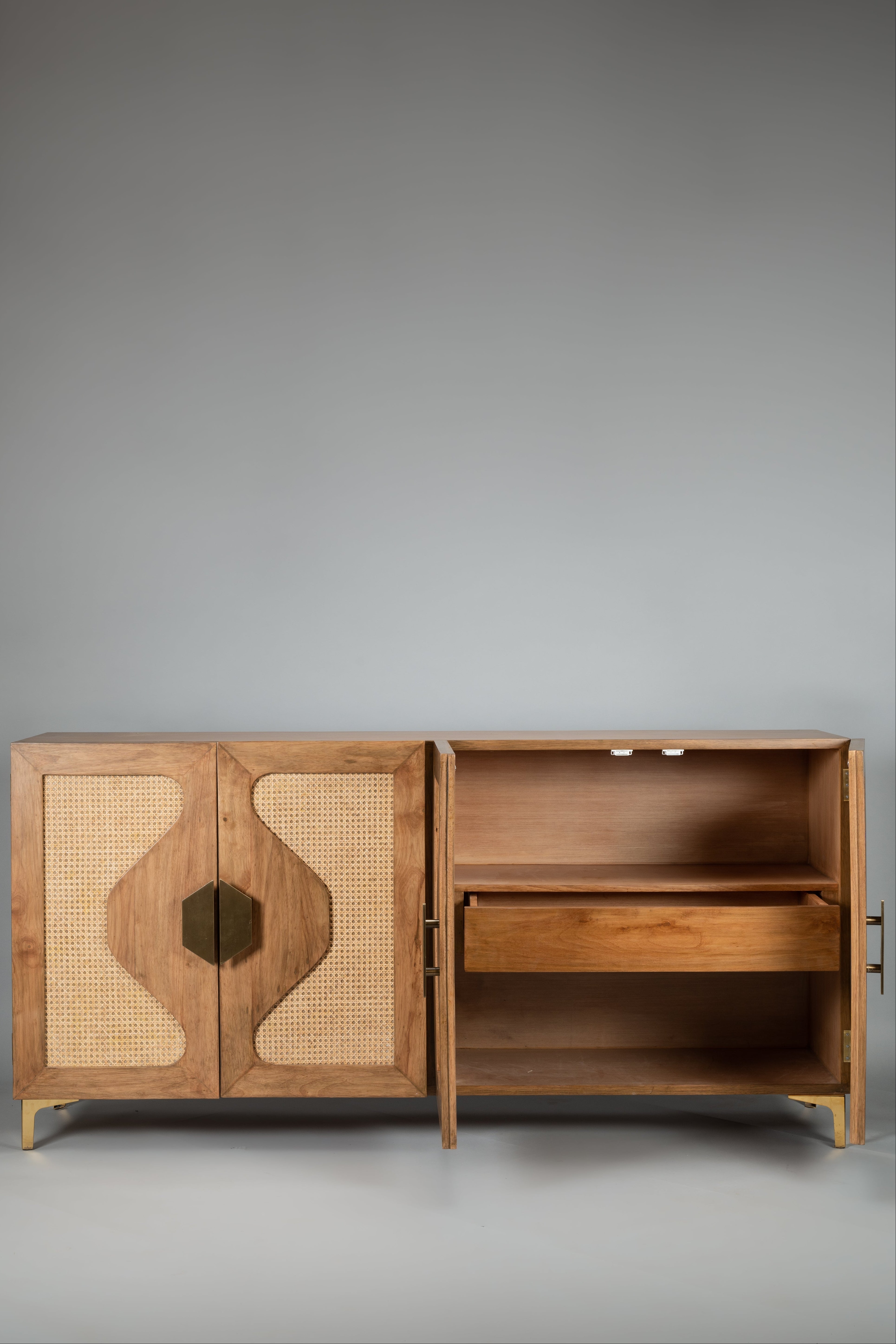 Wooden cabinet with wicker door on a gray background