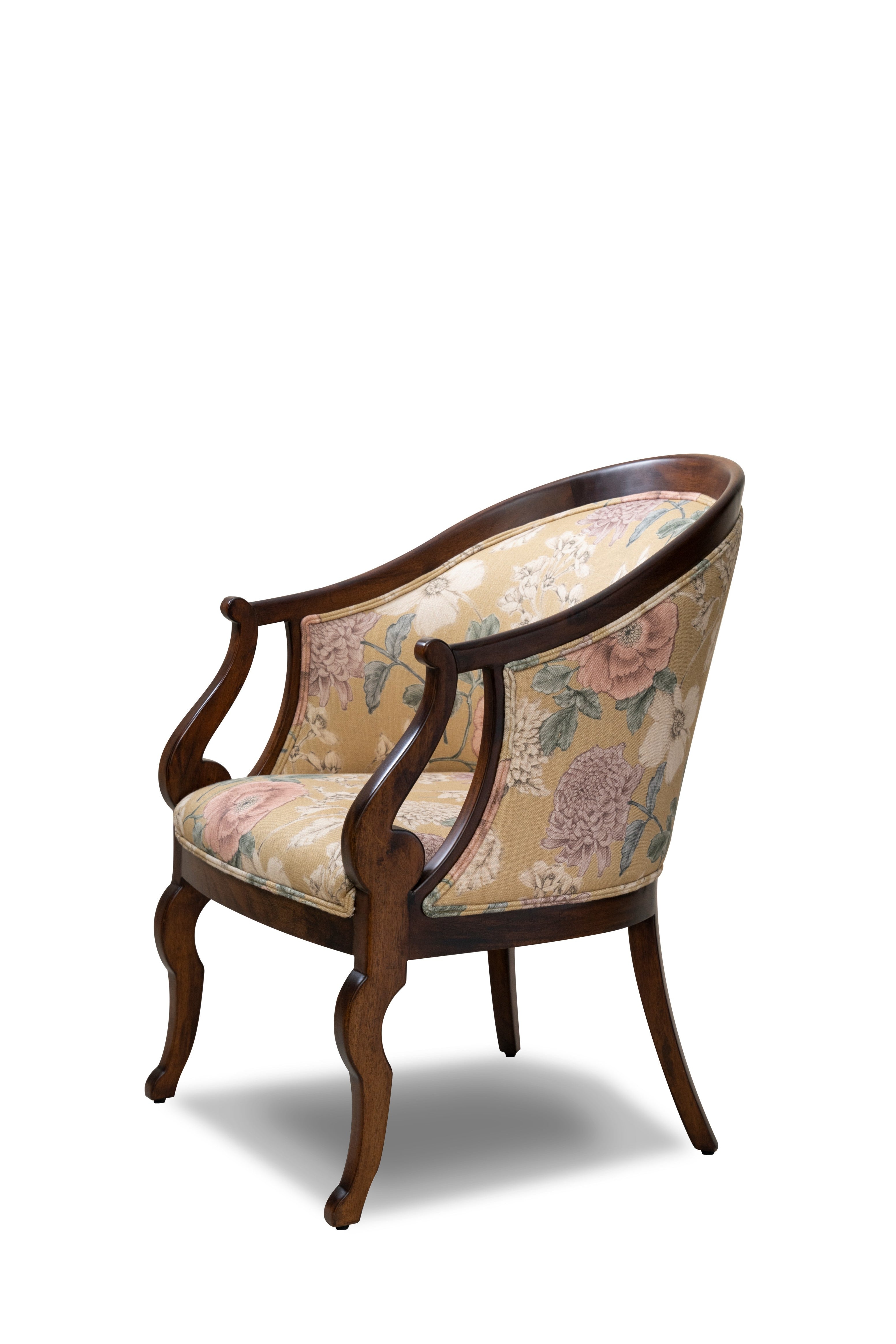 Decorative armchair with floral patterned fabric on a white background