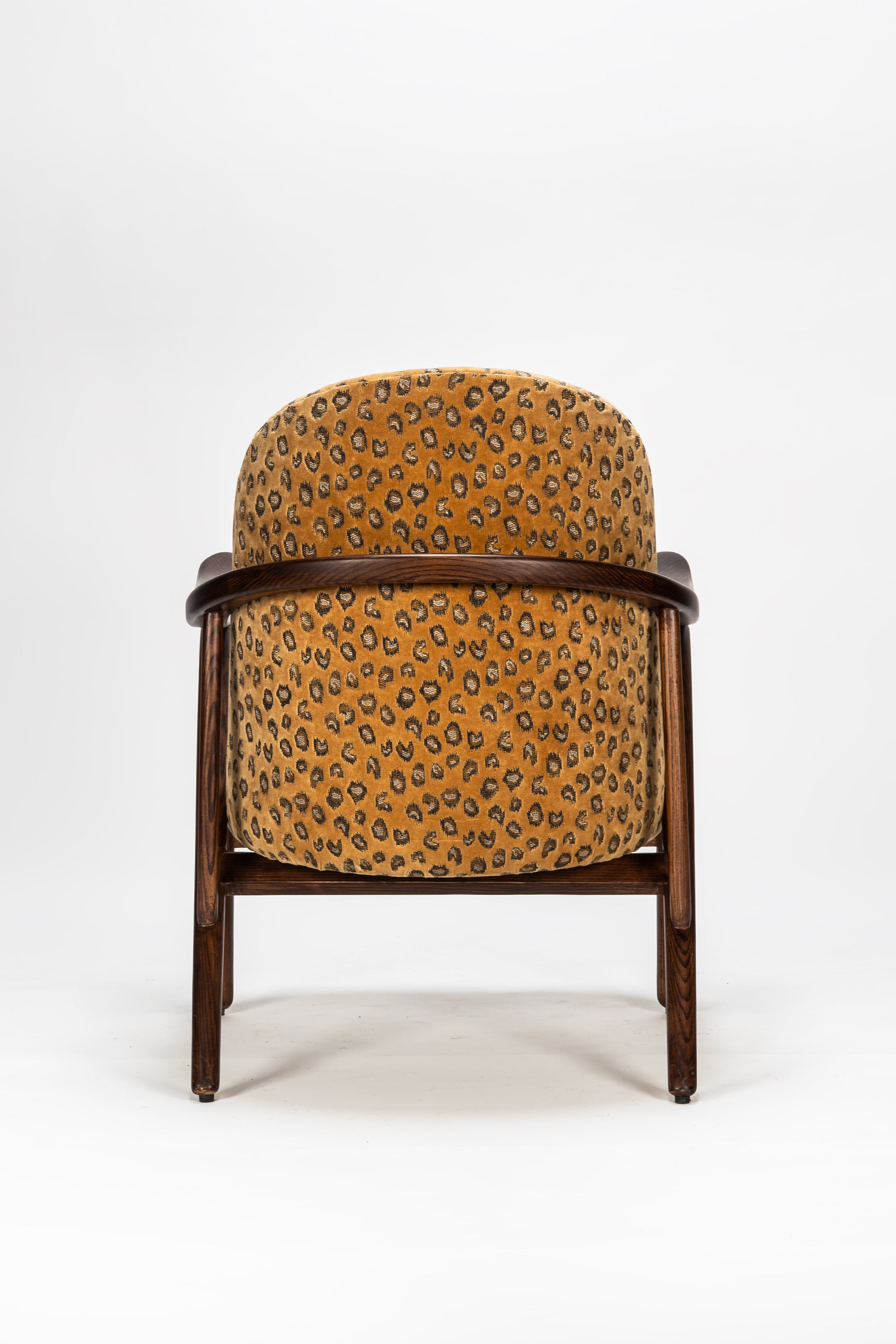 Chair with leopard print fabric on a white background