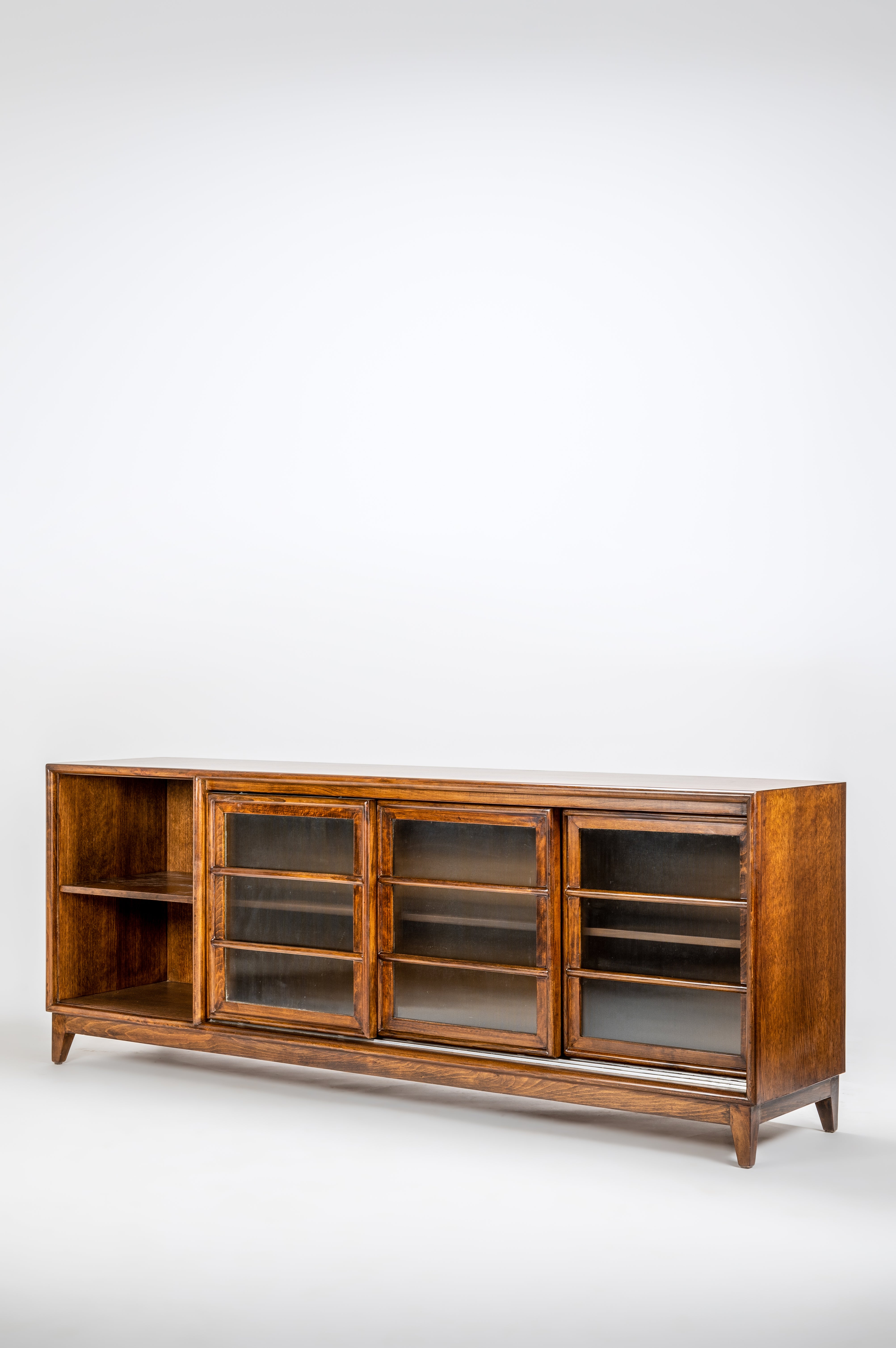 Wooden cabinet with glass doors on a white background
