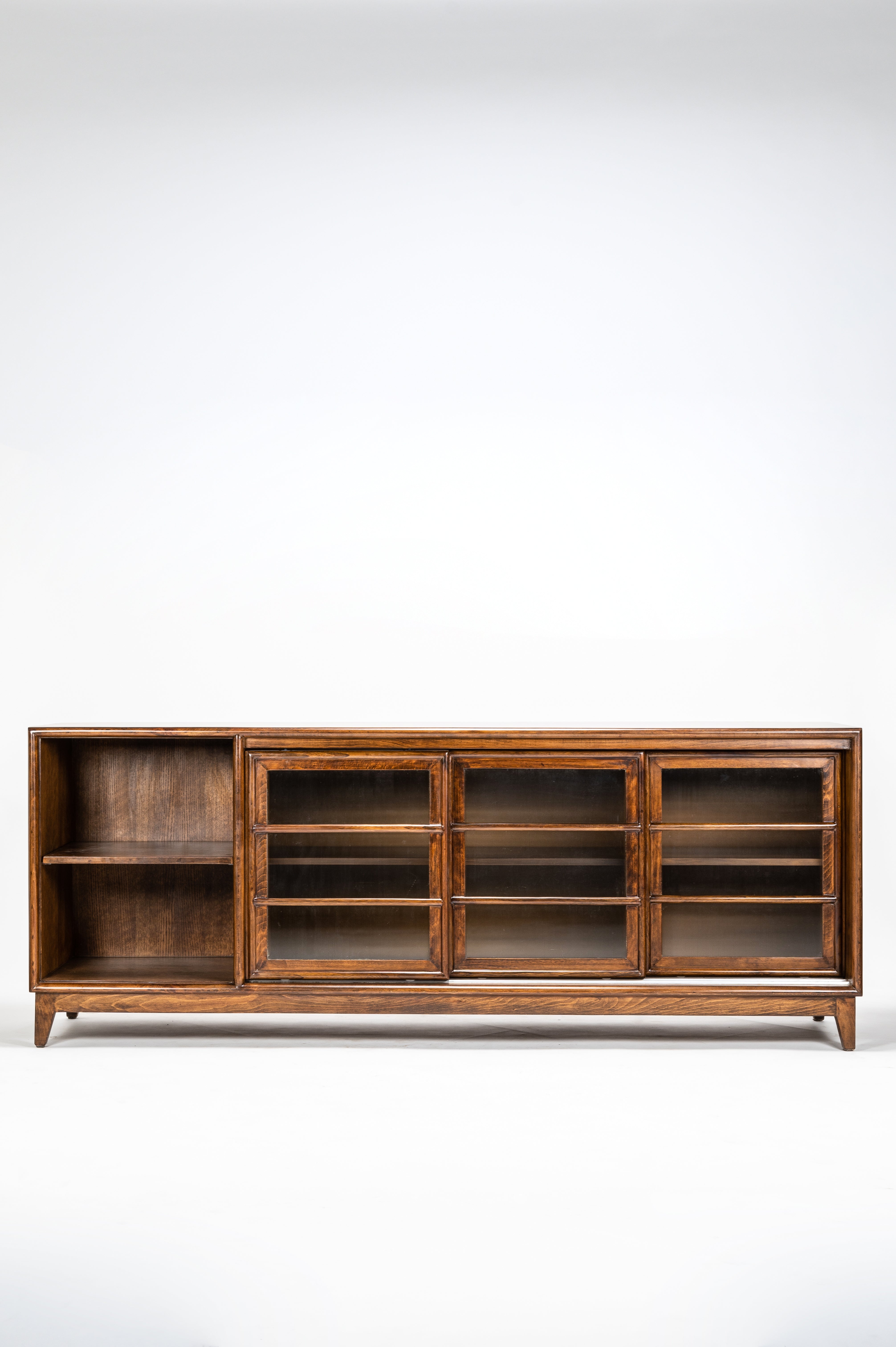 Wooden cabinet with glass doors on a white background