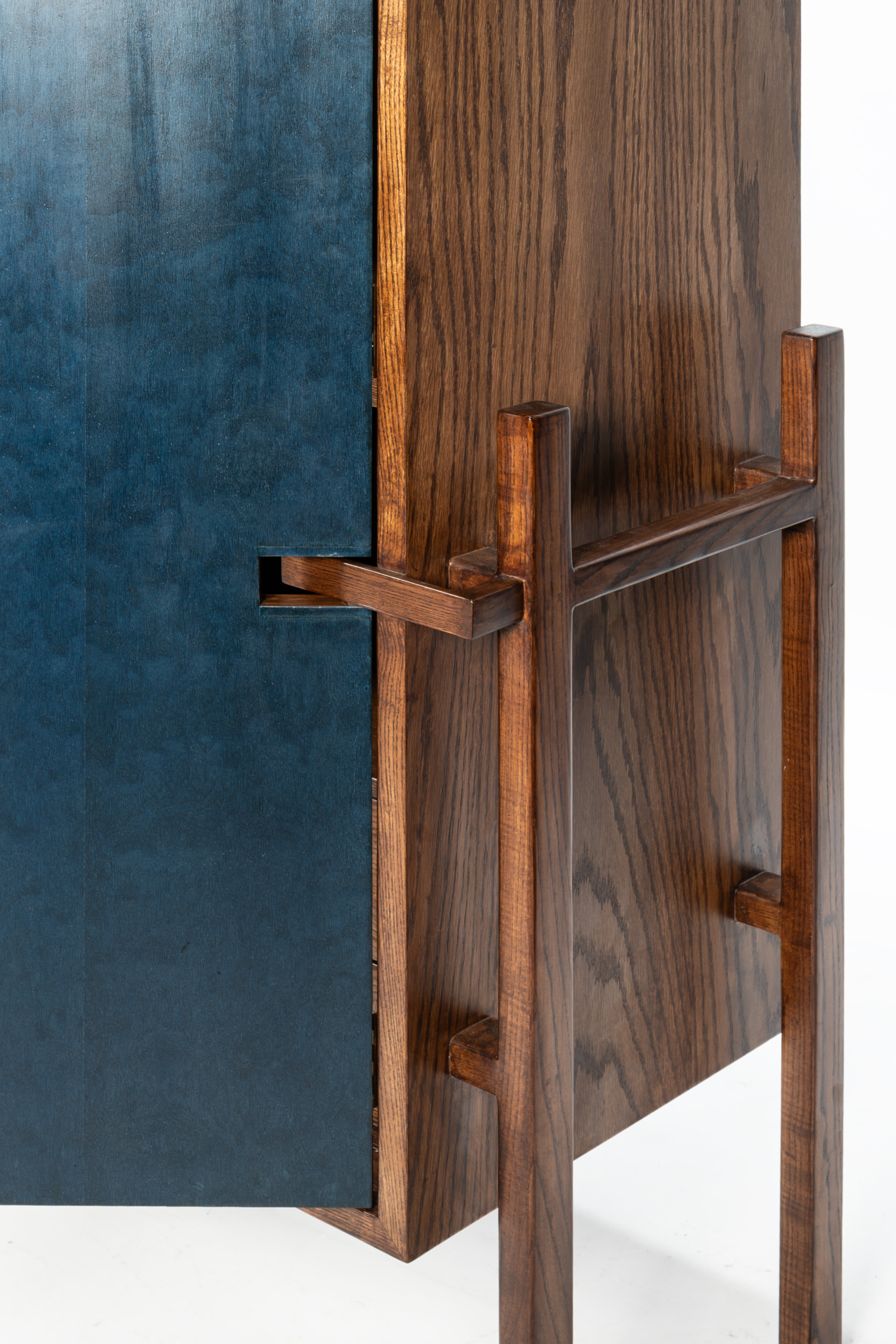 Wooden sculpture with a blue background