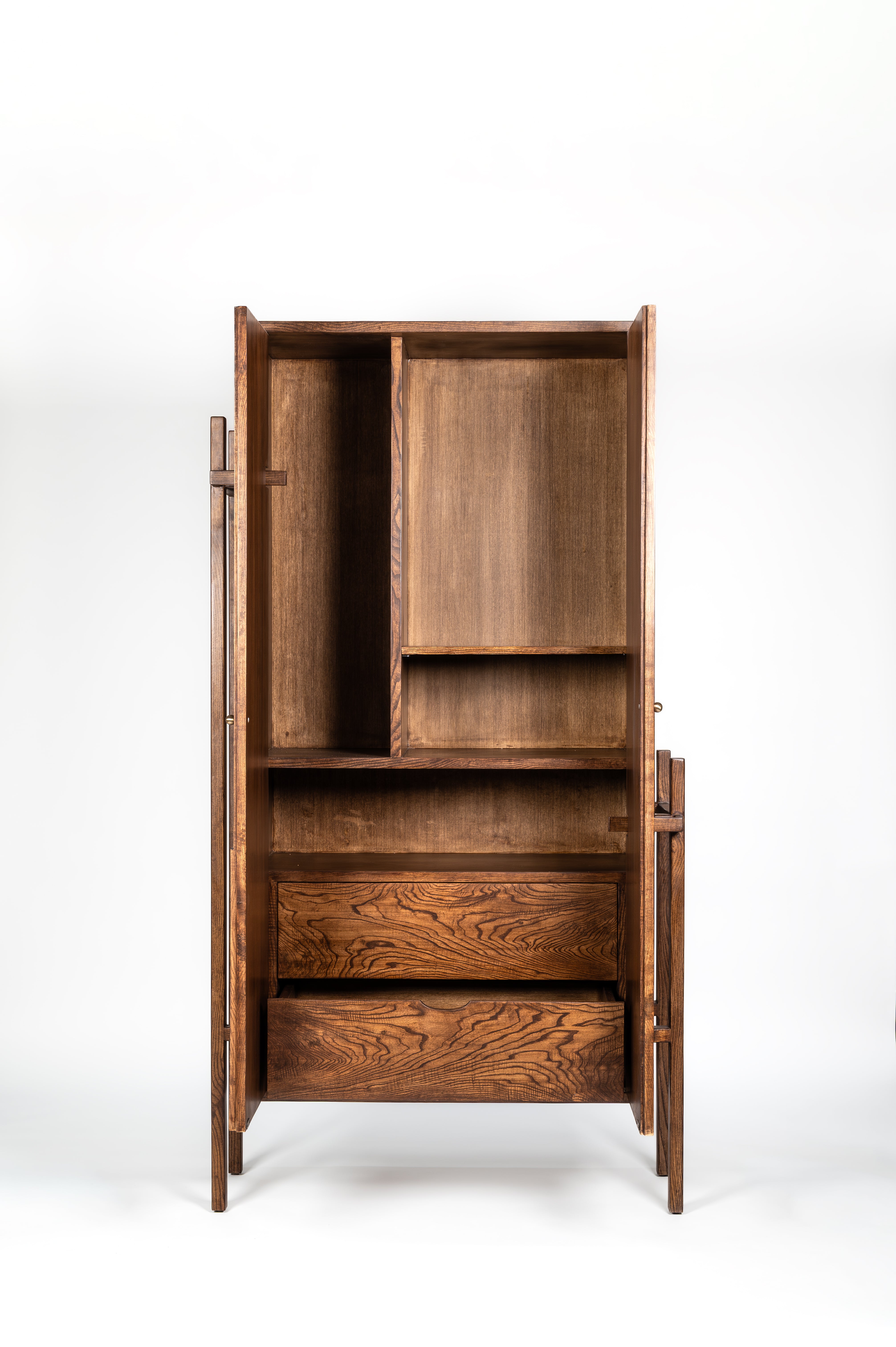 Wooden cabinet with open doors on a white background