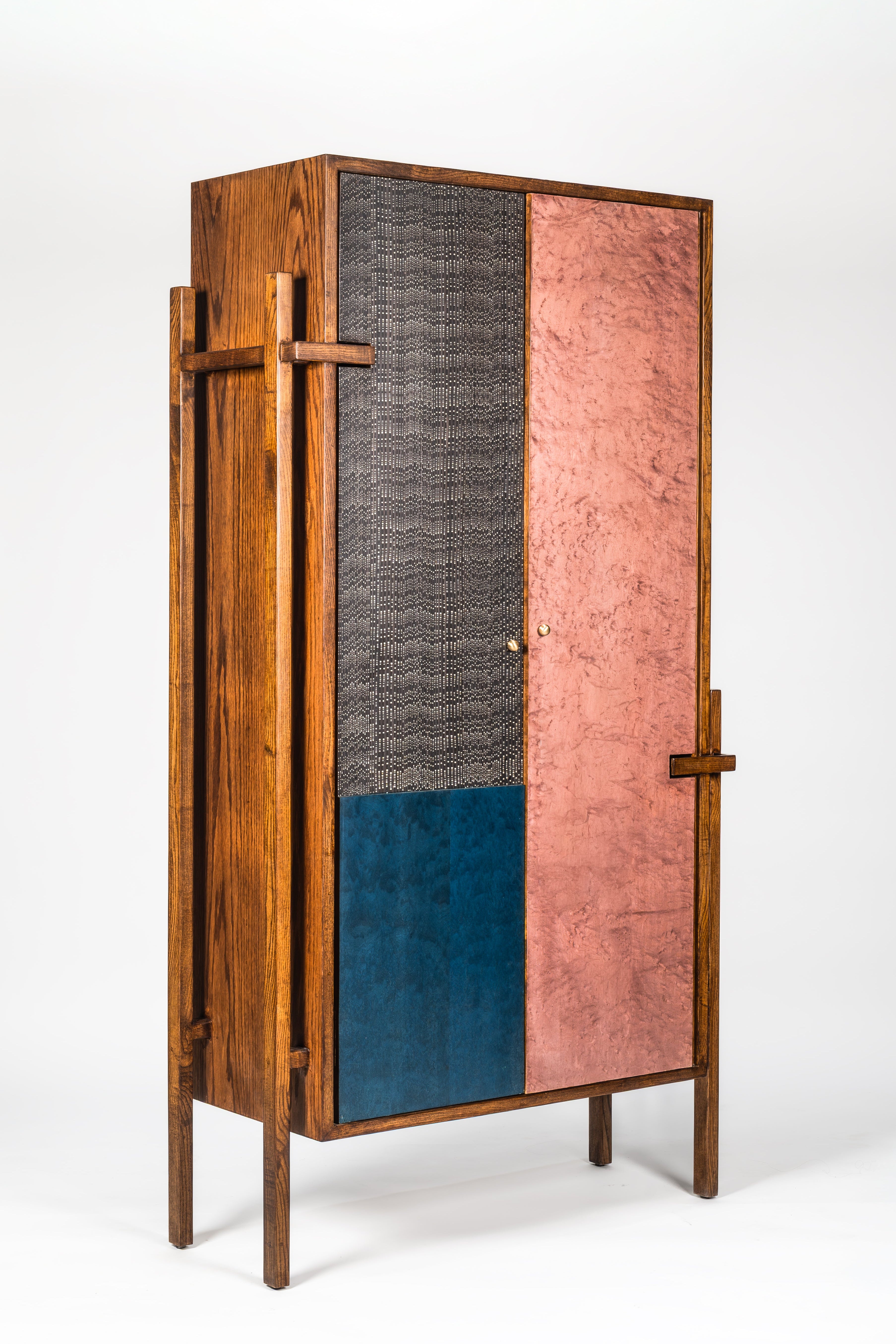 Wooden cabinet with multicolored doors on a white background