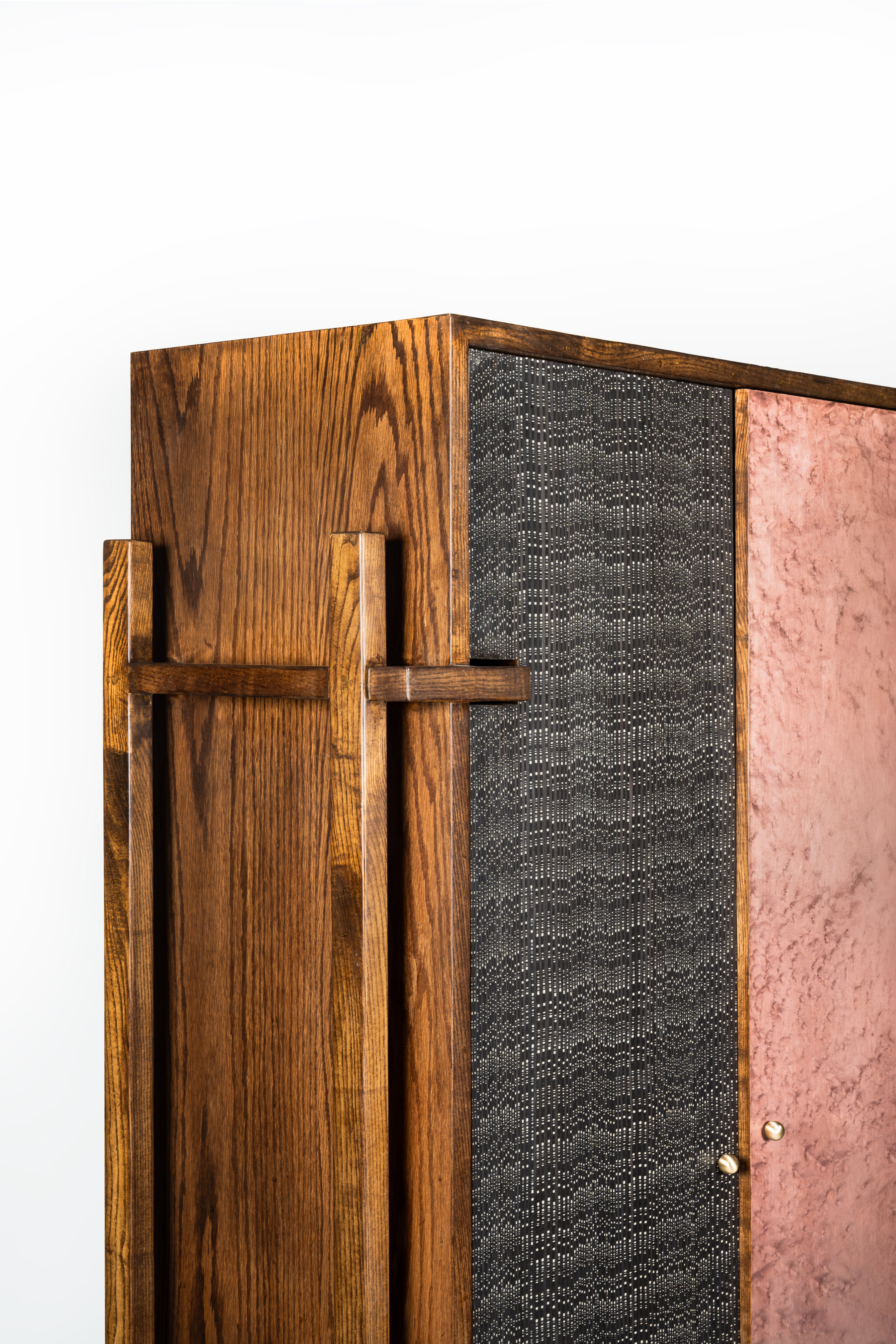 Wooden cabinet with textured side panels on a white background
