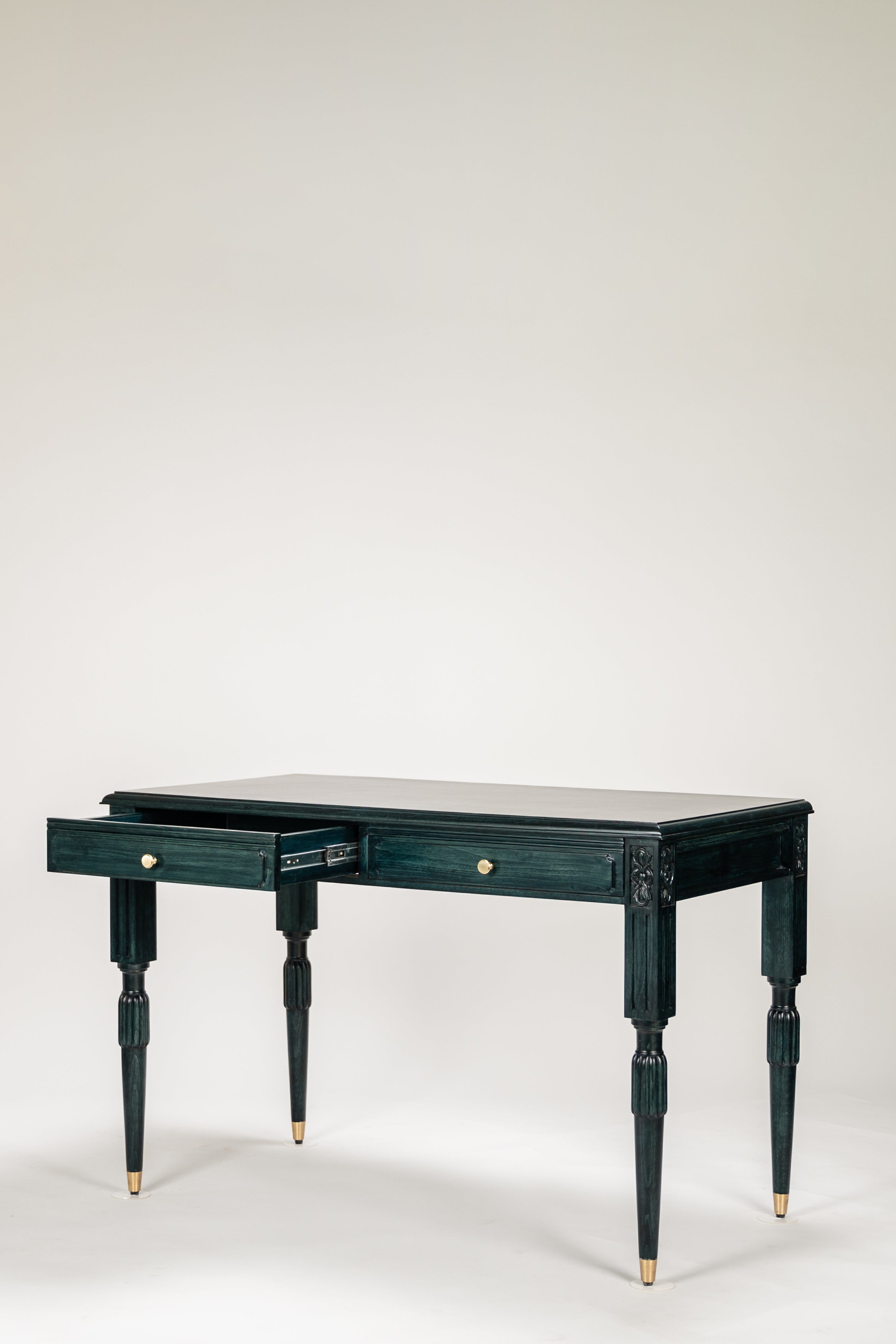Dark green desk with a single drawer on a white background
