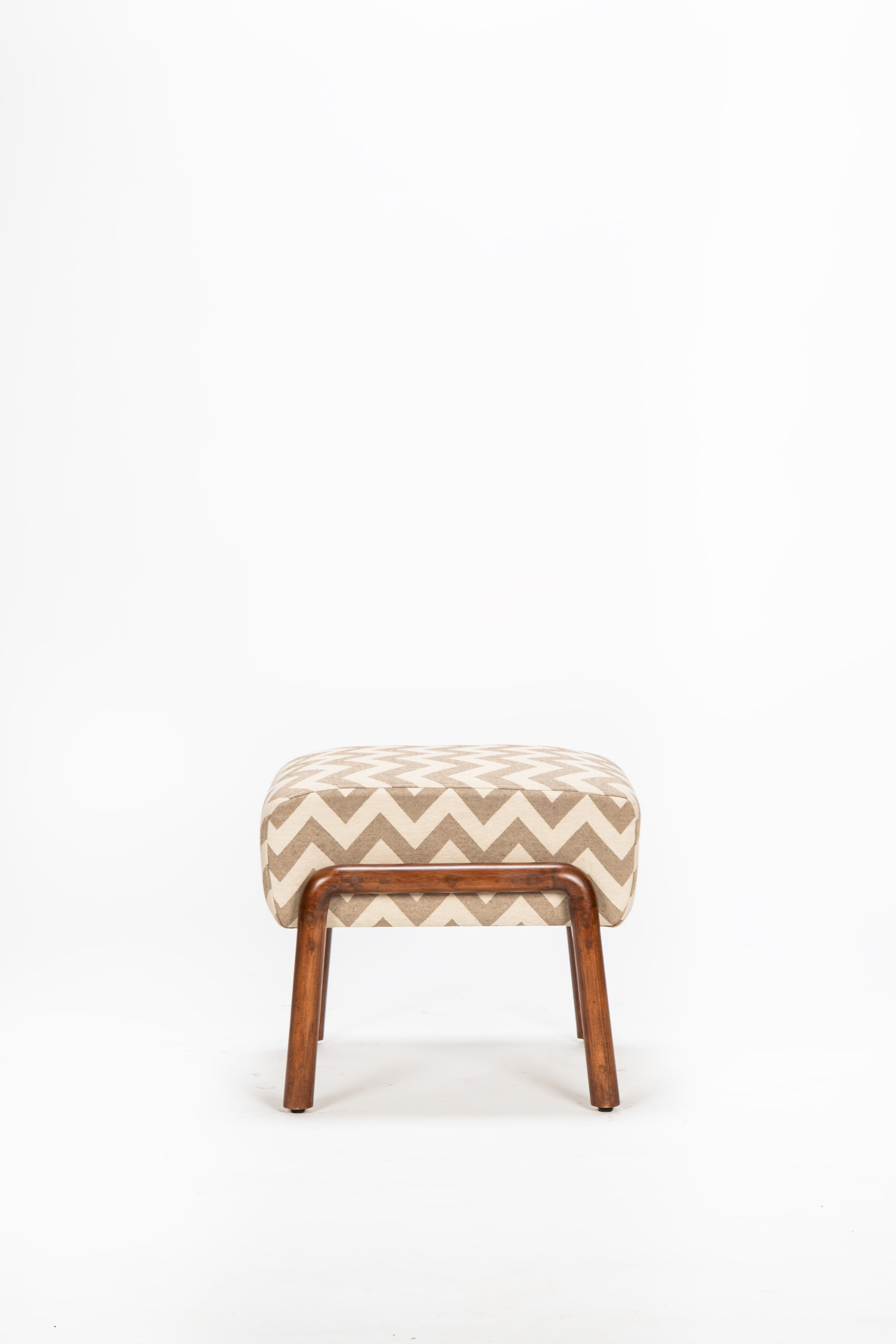 Small stool with zigzag pattern on a white background