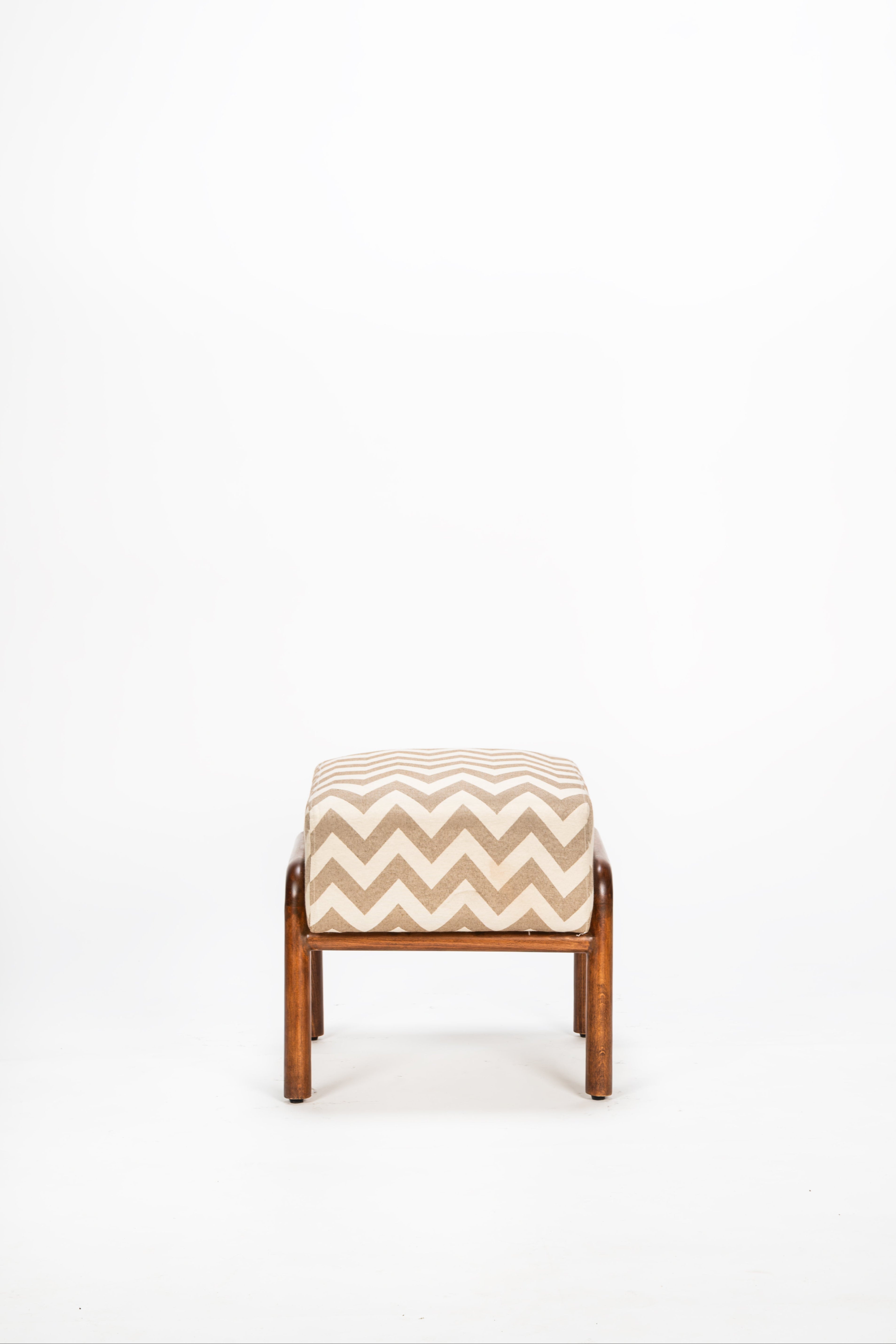 Small stool with a beige and brown chevron pattern on a white background