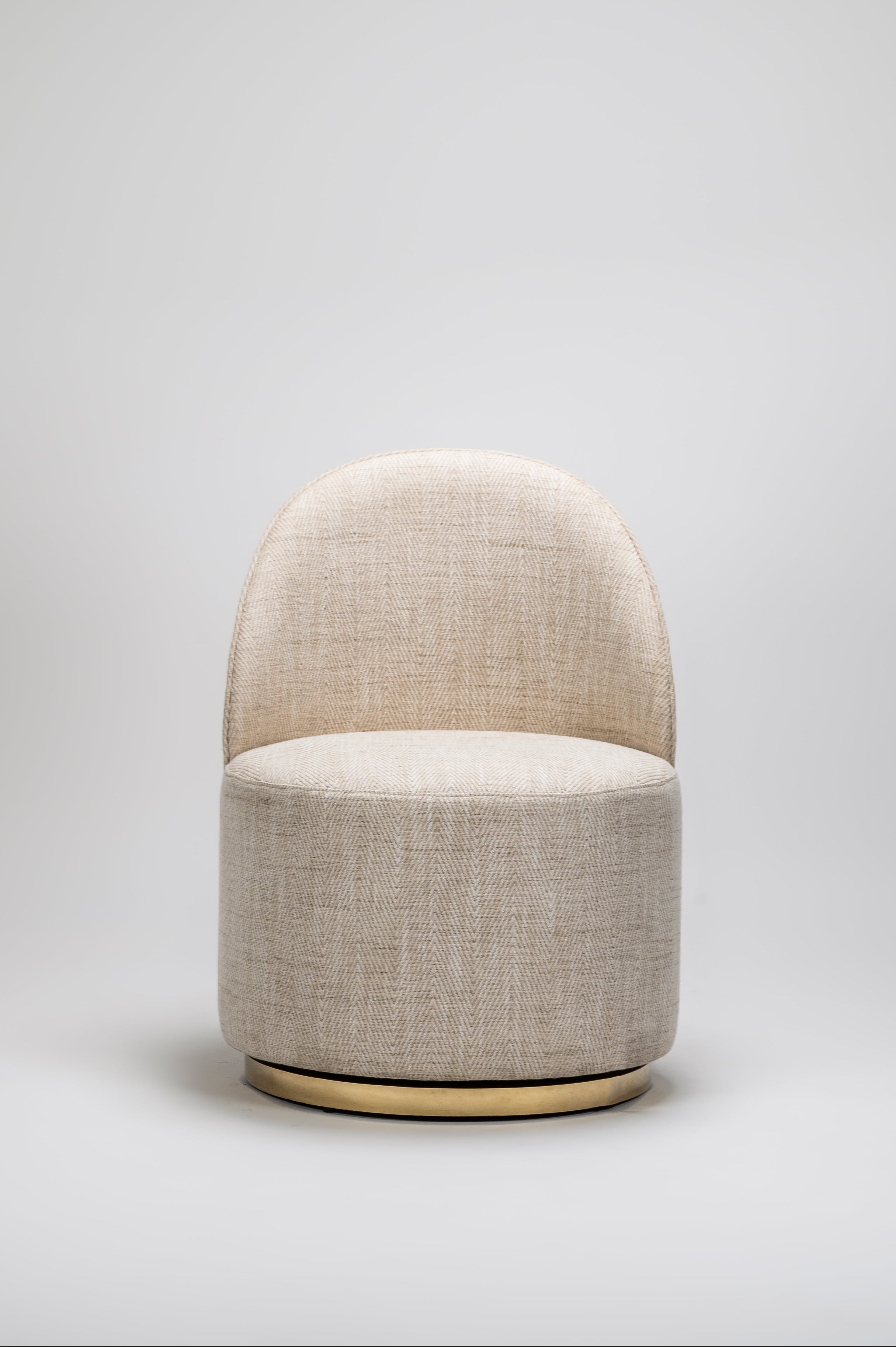 Beige fabric stool on a light gray background