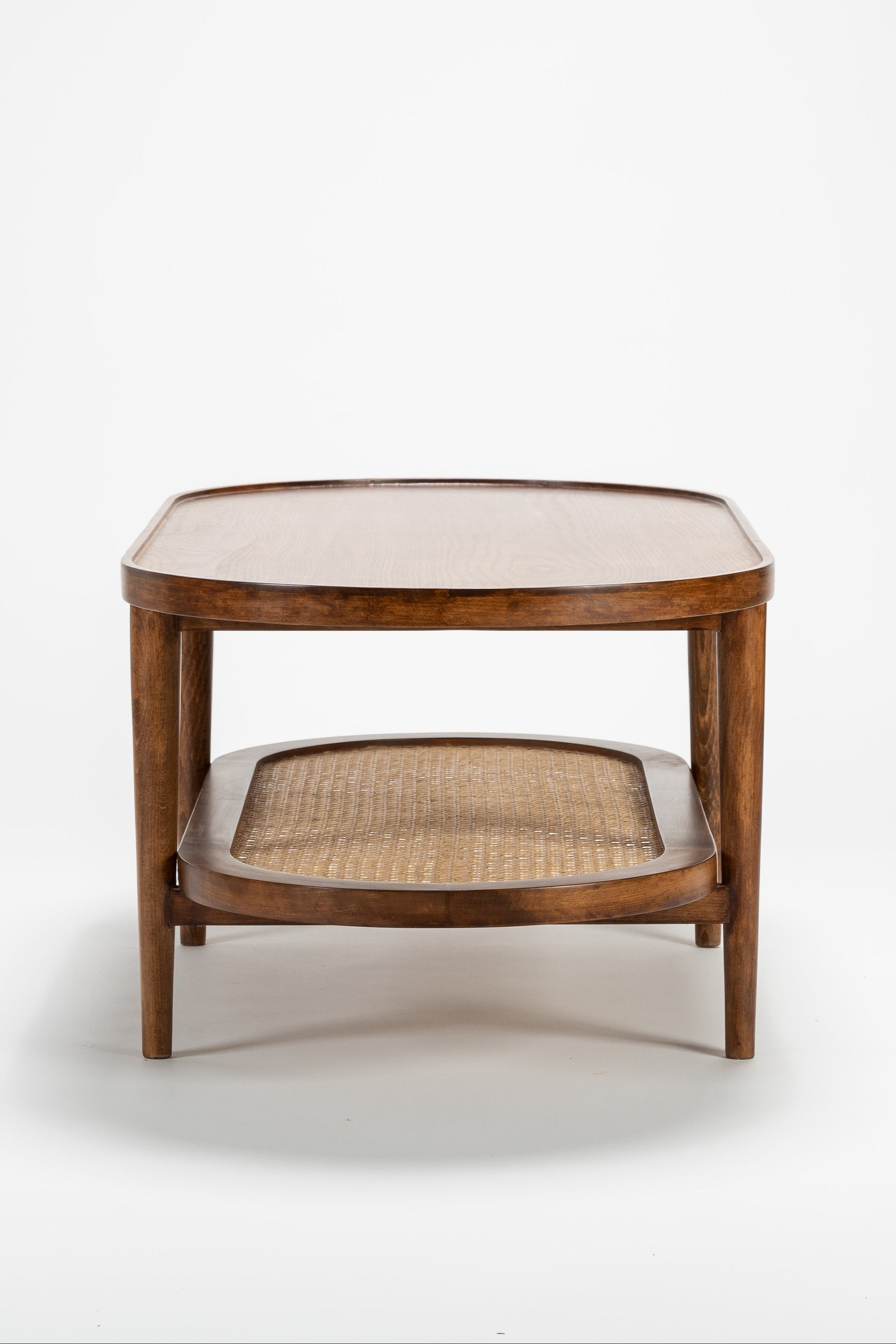 Wooden side table with woven seat on a white background