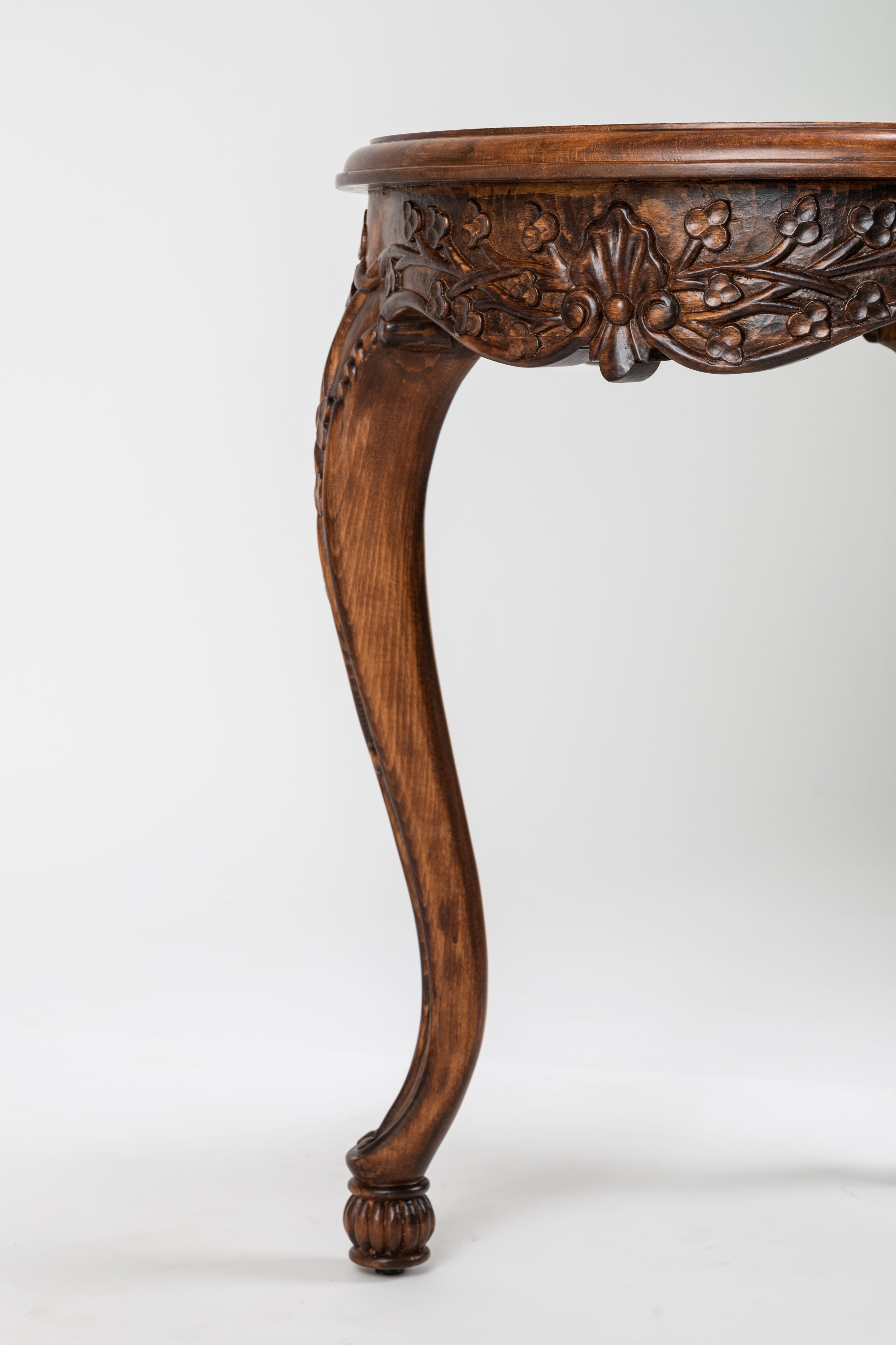Carved wooden table leg on a white background