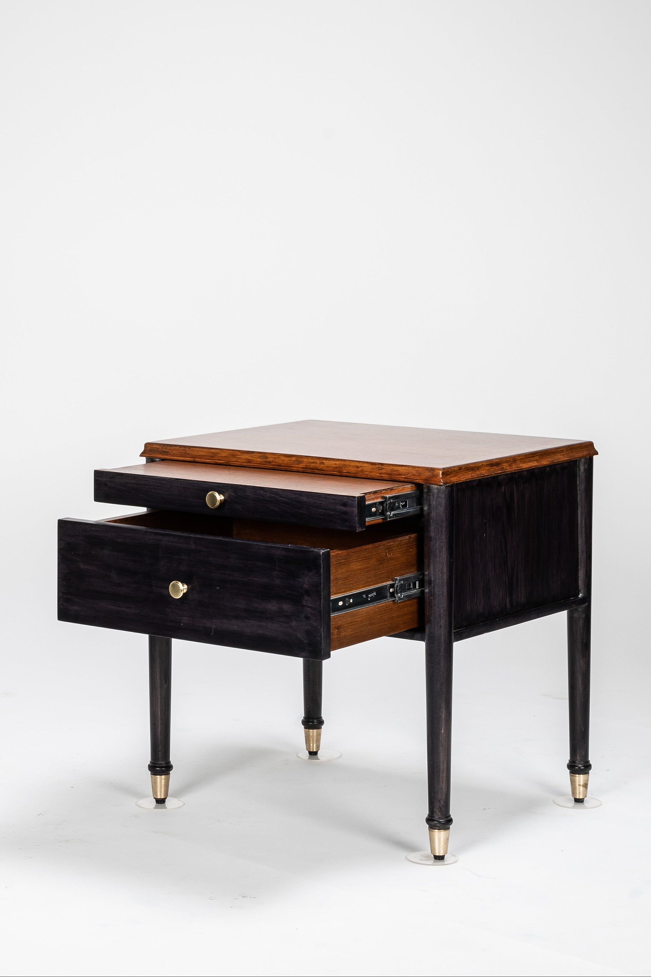 Wooden side table with a drawer on a white background