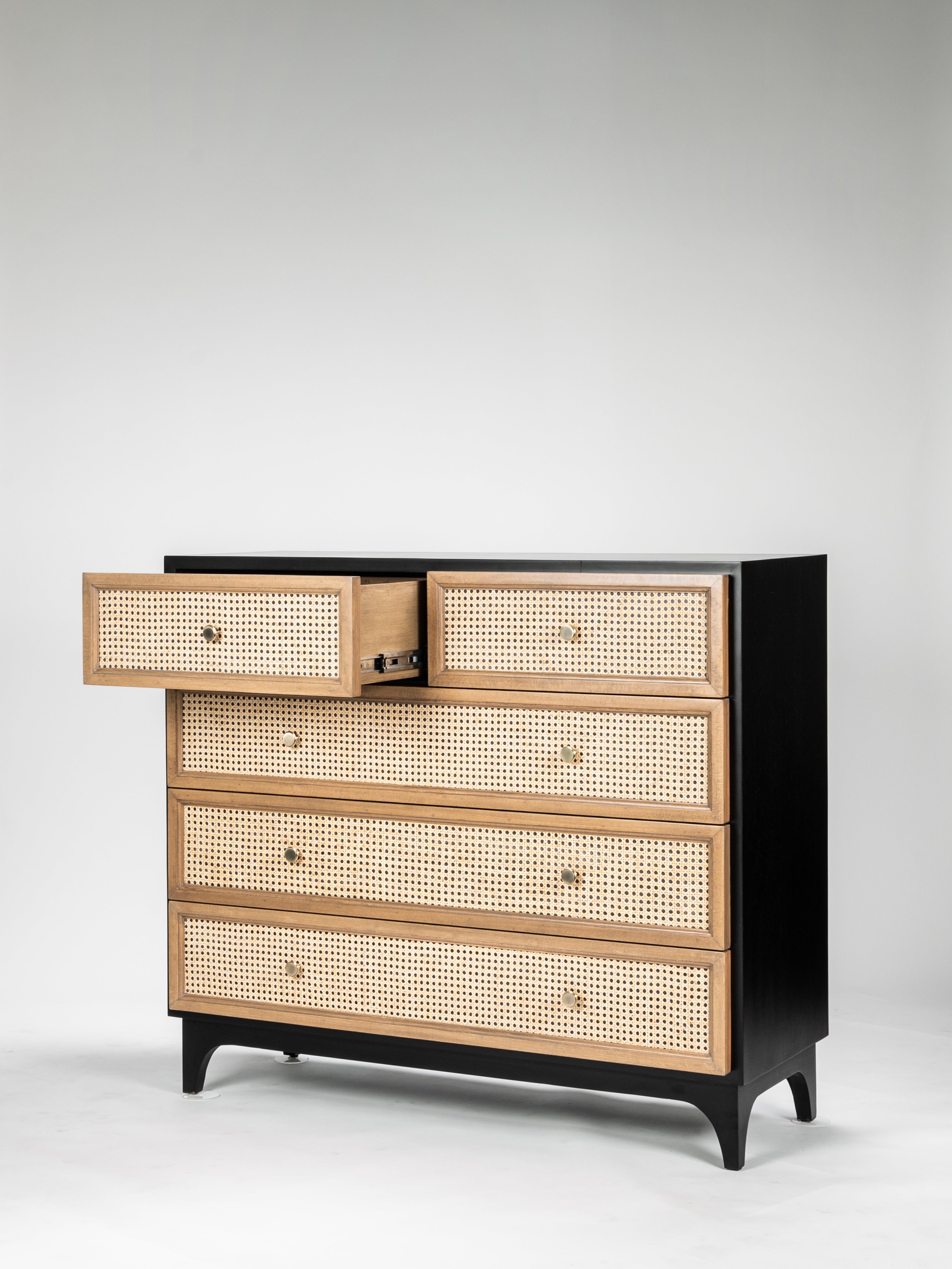 Dresser with wooden drawers and black frame on a white background