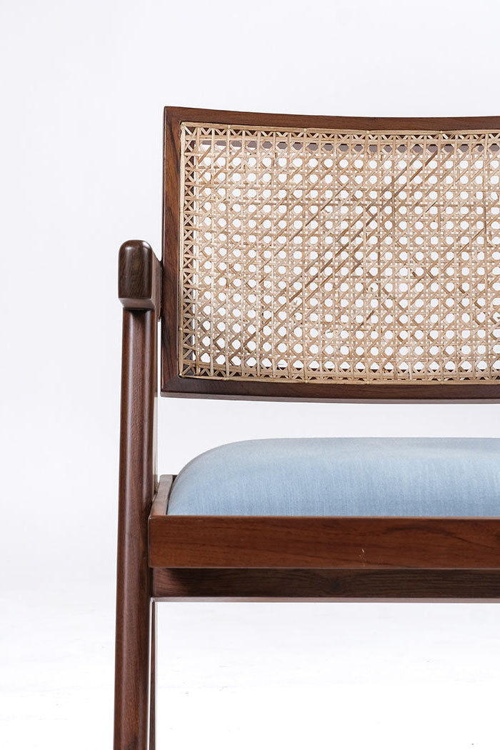 Chair with wicker backrest and wooden frame on a white background