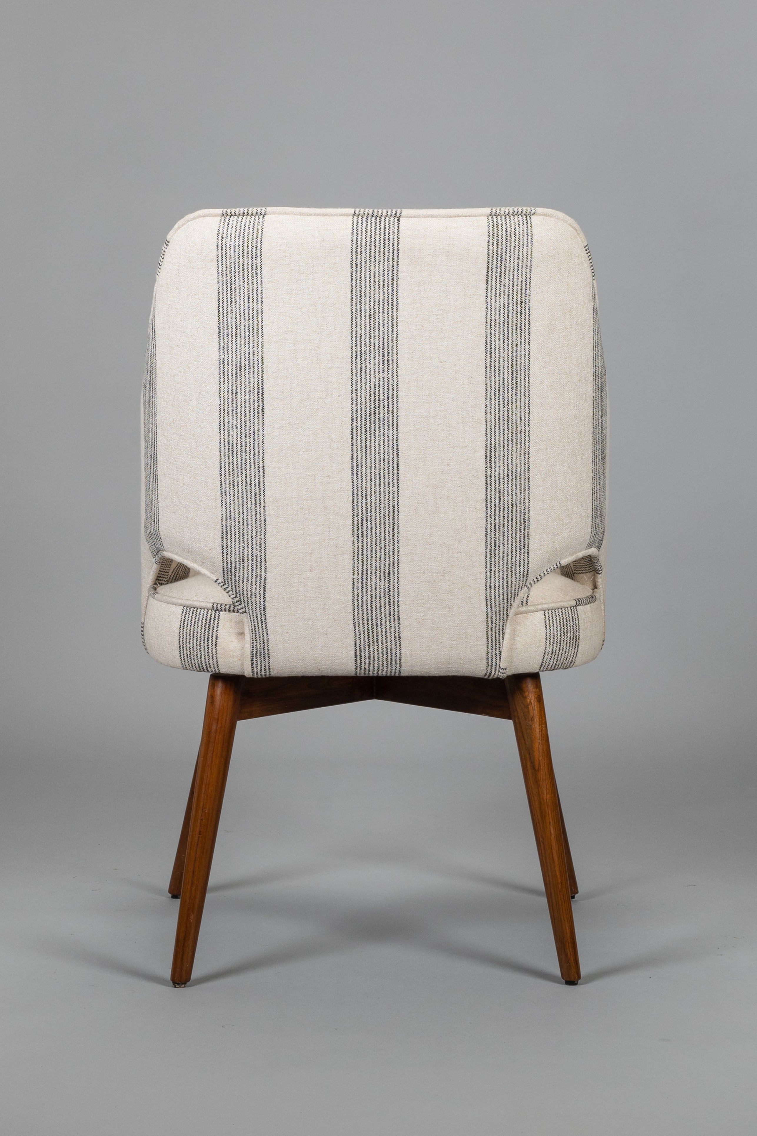 Chair with striped pattern on a gray background