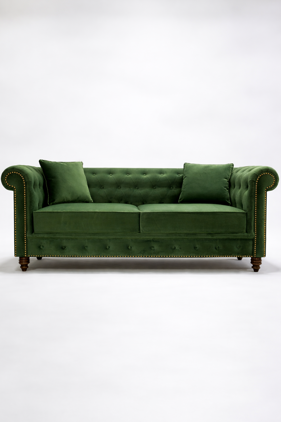 Green velvet sofa on a white background