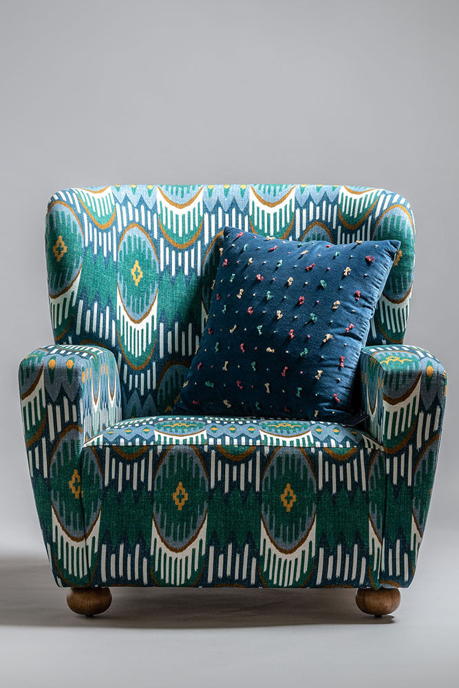 Decorative armchair with a patterned design on a gray background
