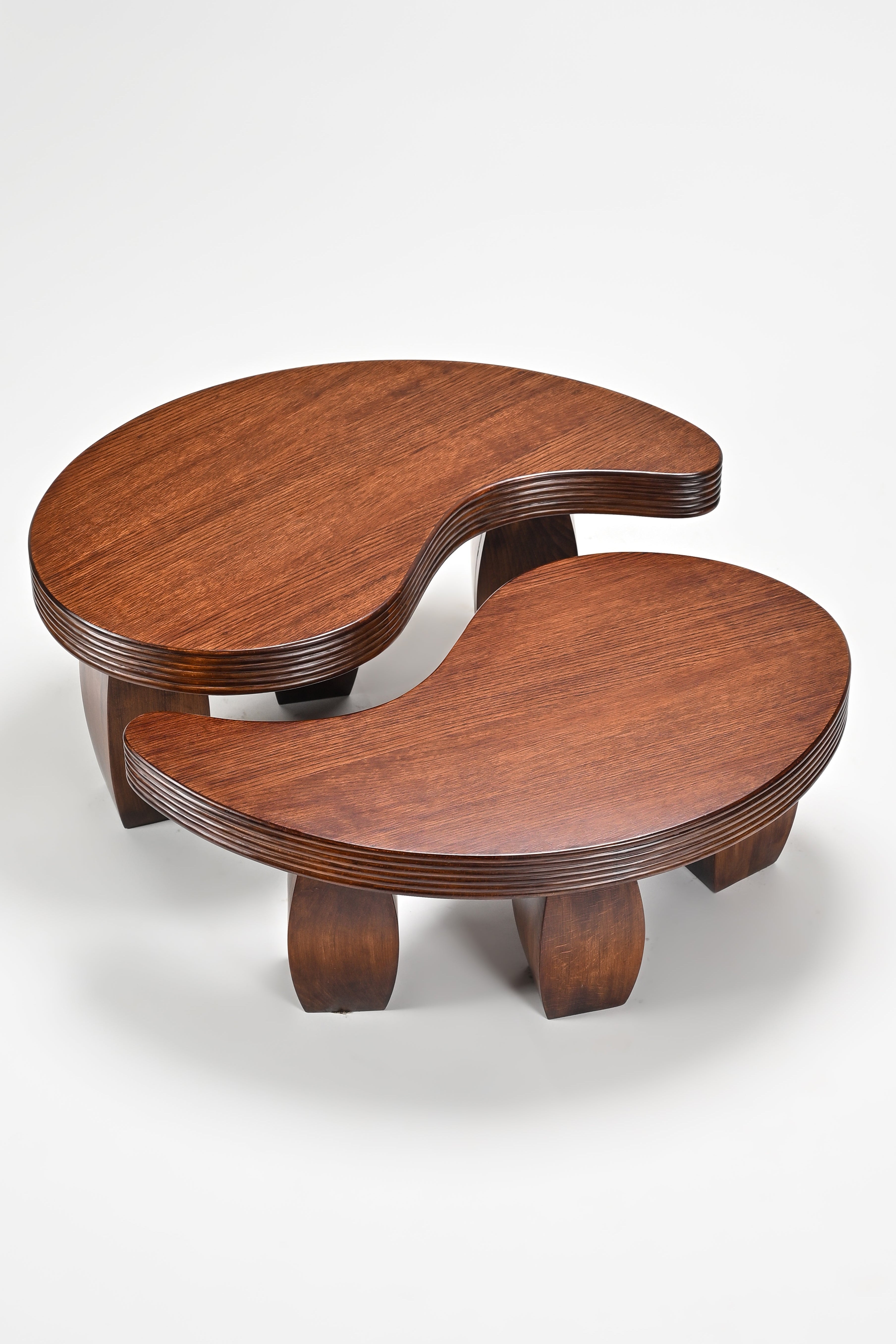 Two wooden coffee tables with a unique design on a white background