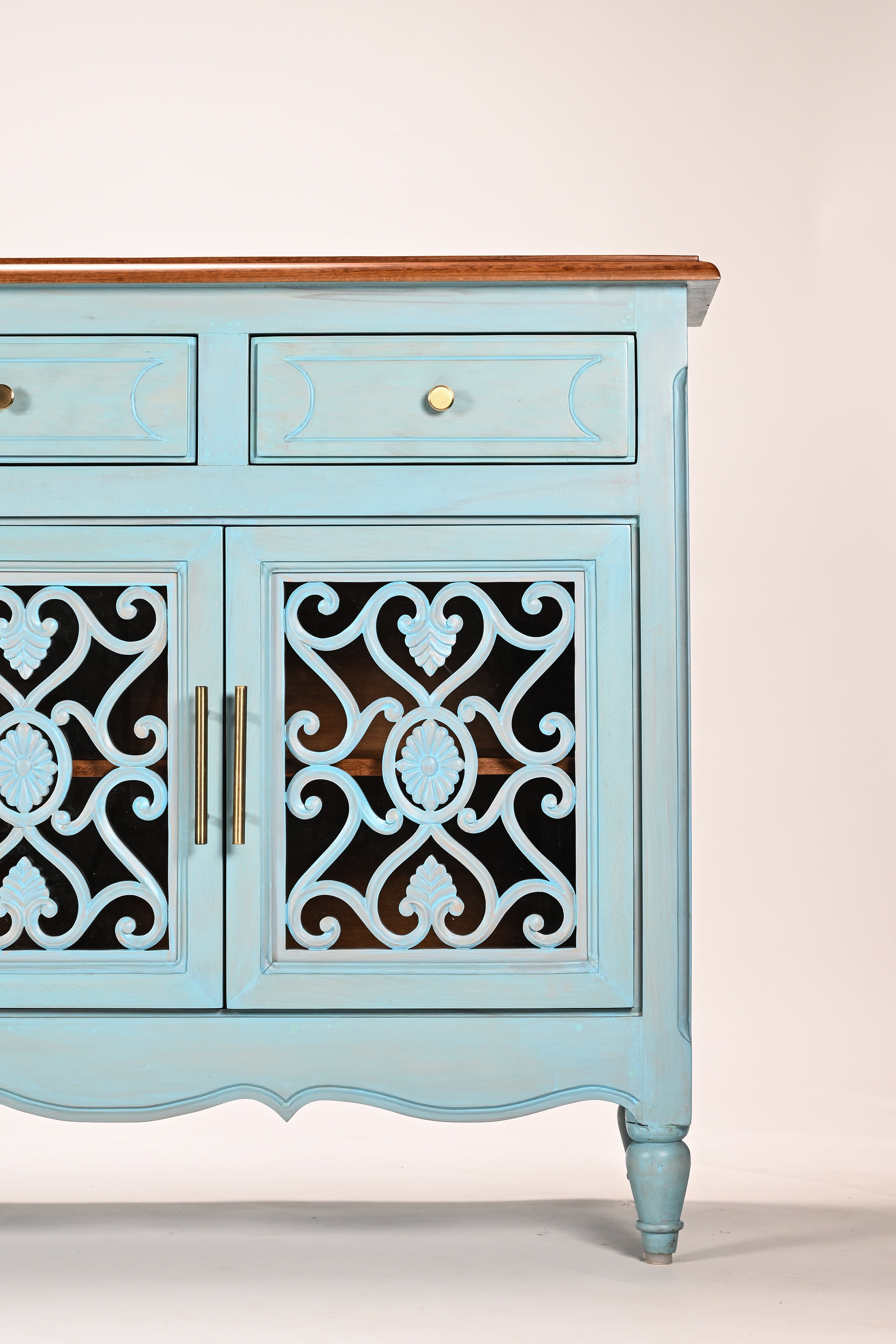 Light blue sideboard with decorative black patterns on a white background