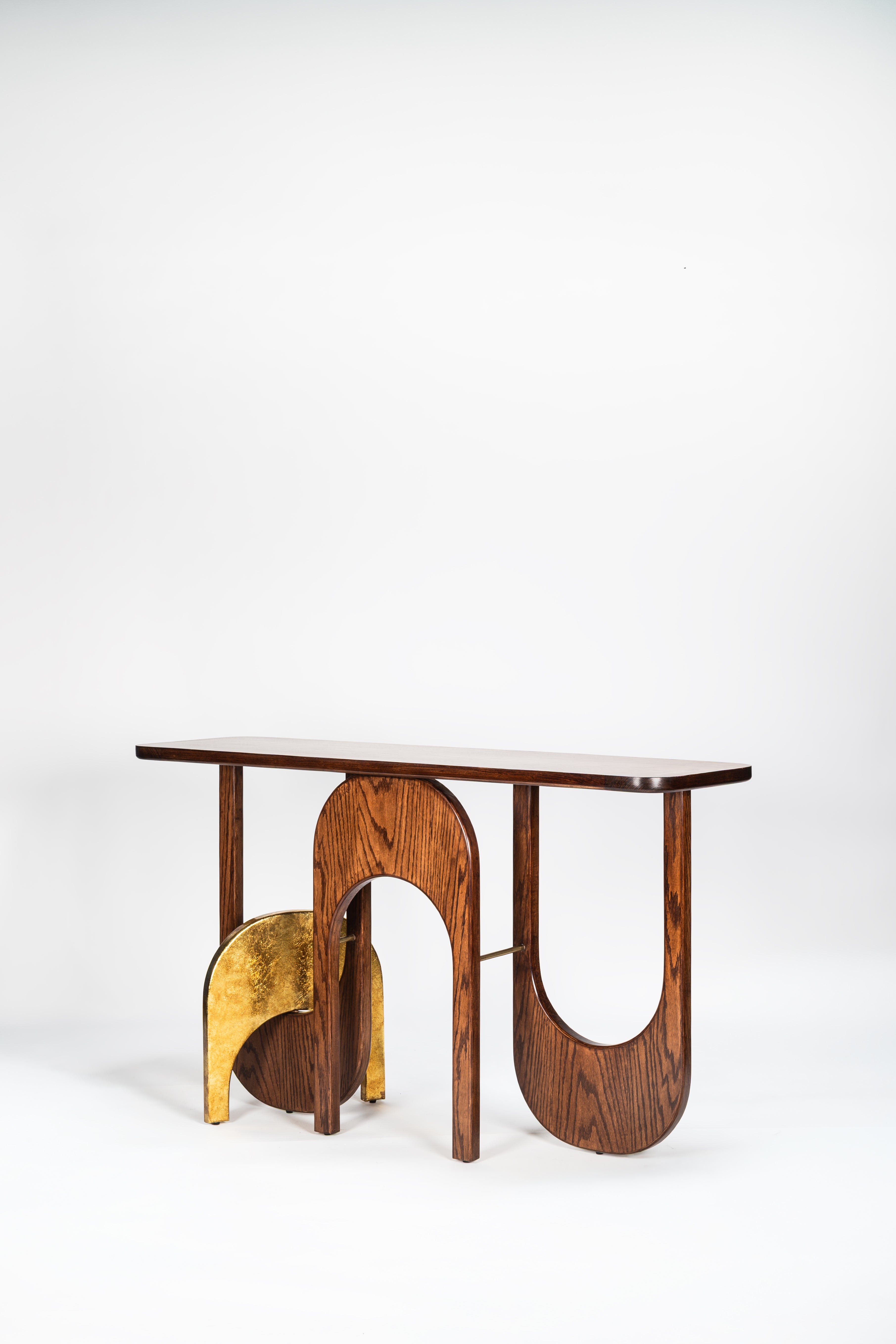 Wooden console table with a gold accent on a white background