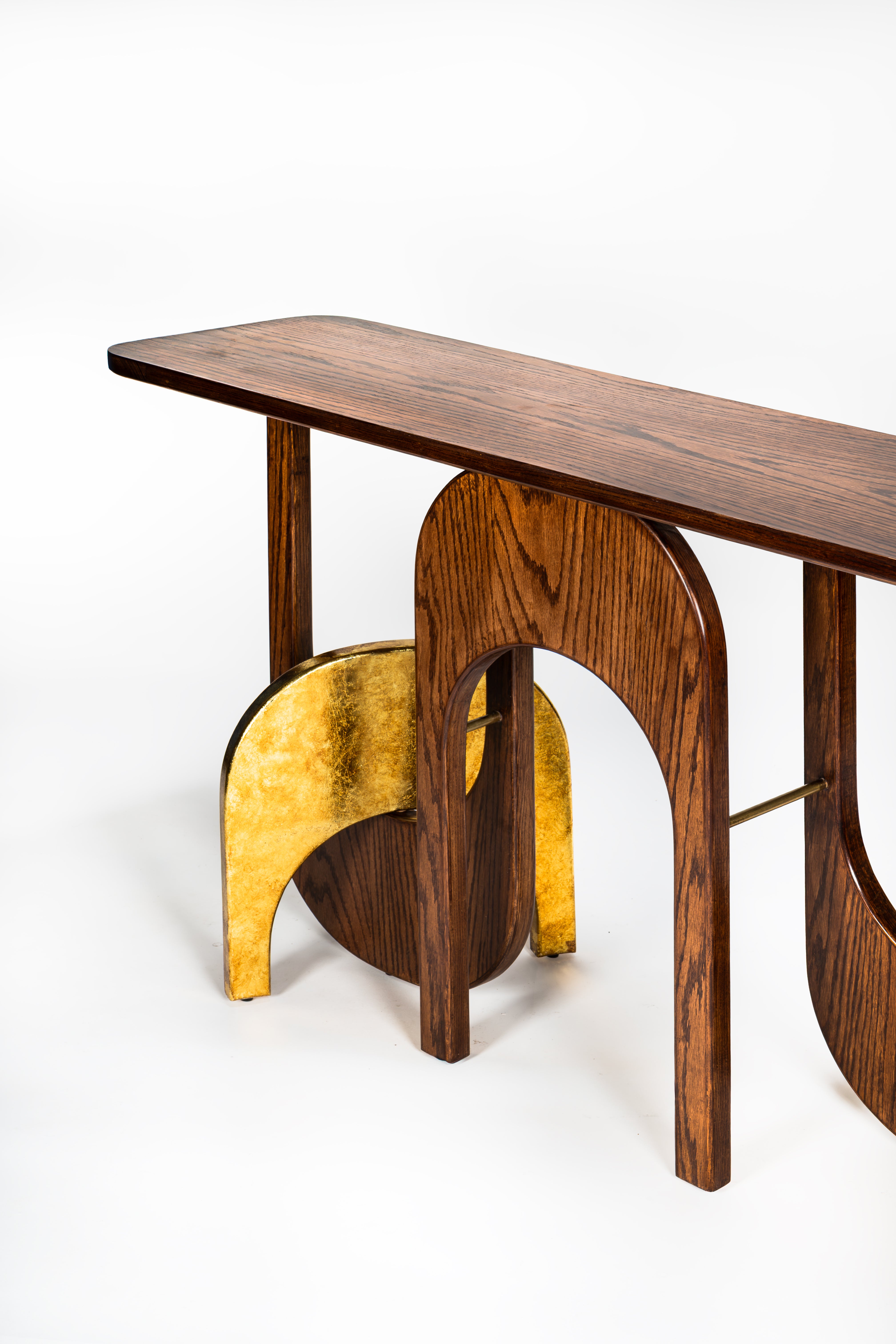 Wooden bench with gold undercarriage on a white background