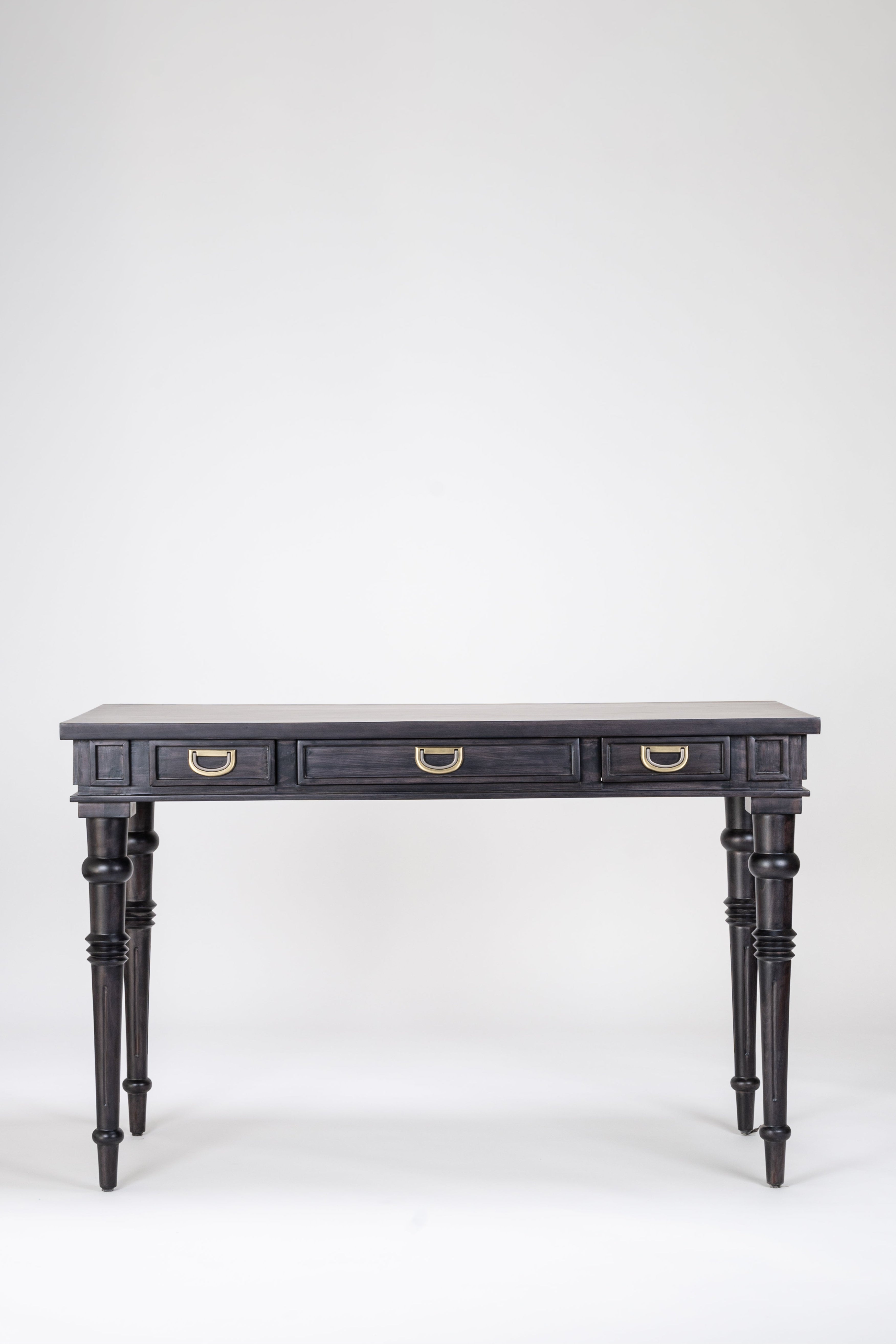 Dark wooden desk with four drawers on a white background