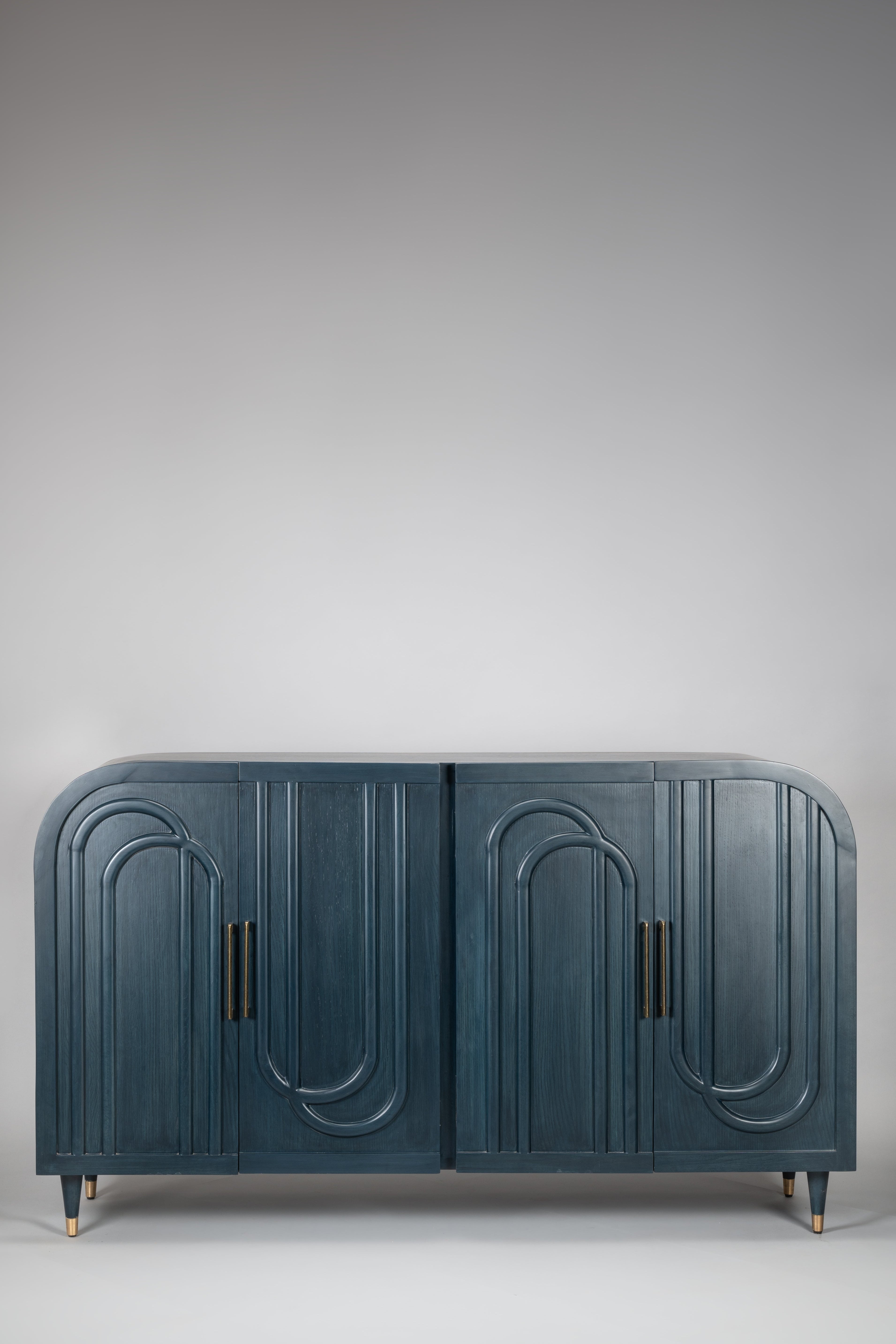 Blue cabinet with decorative arches on a gray background