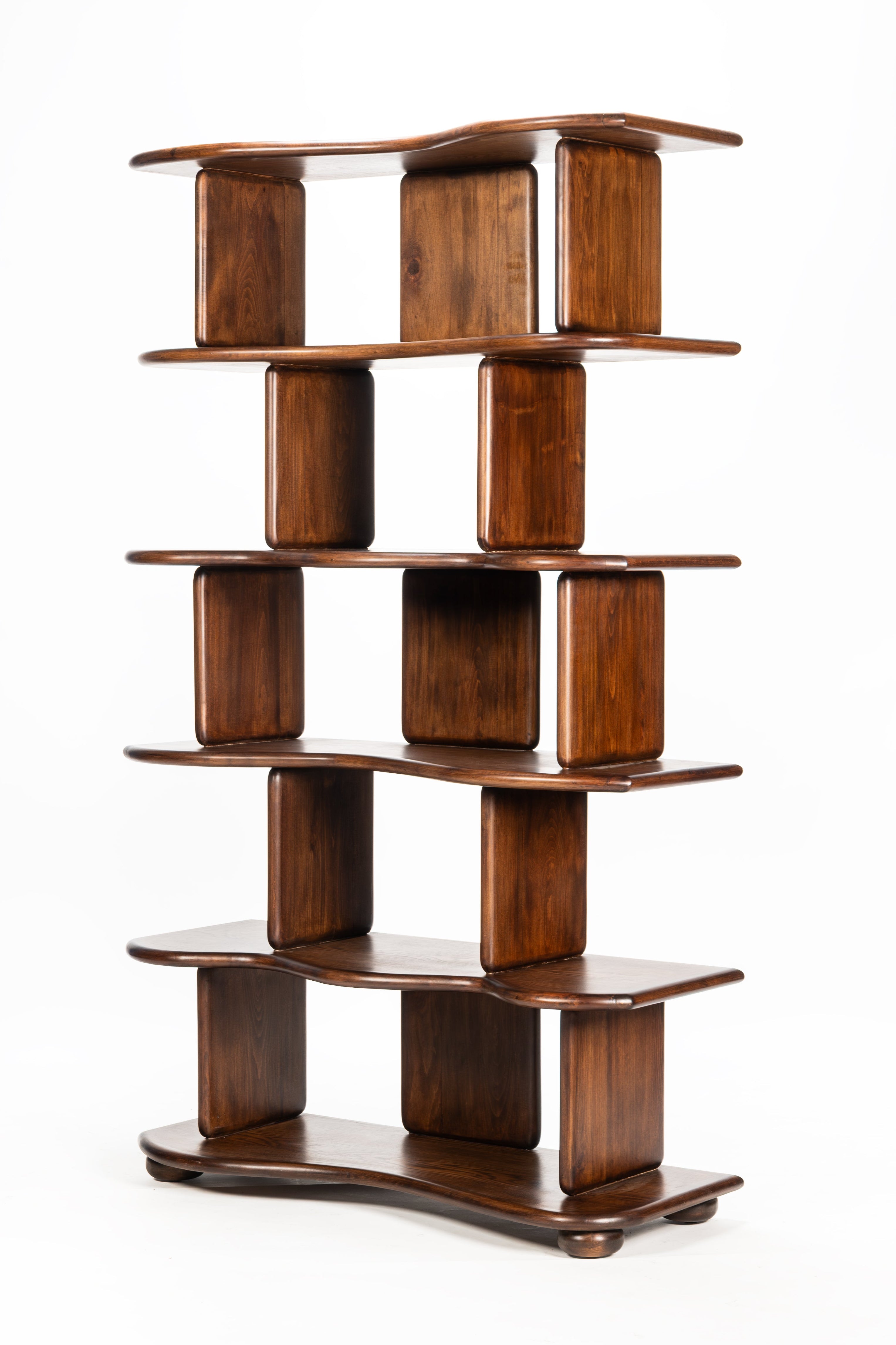 Wooden bookshelf with multiple shelves on a white background