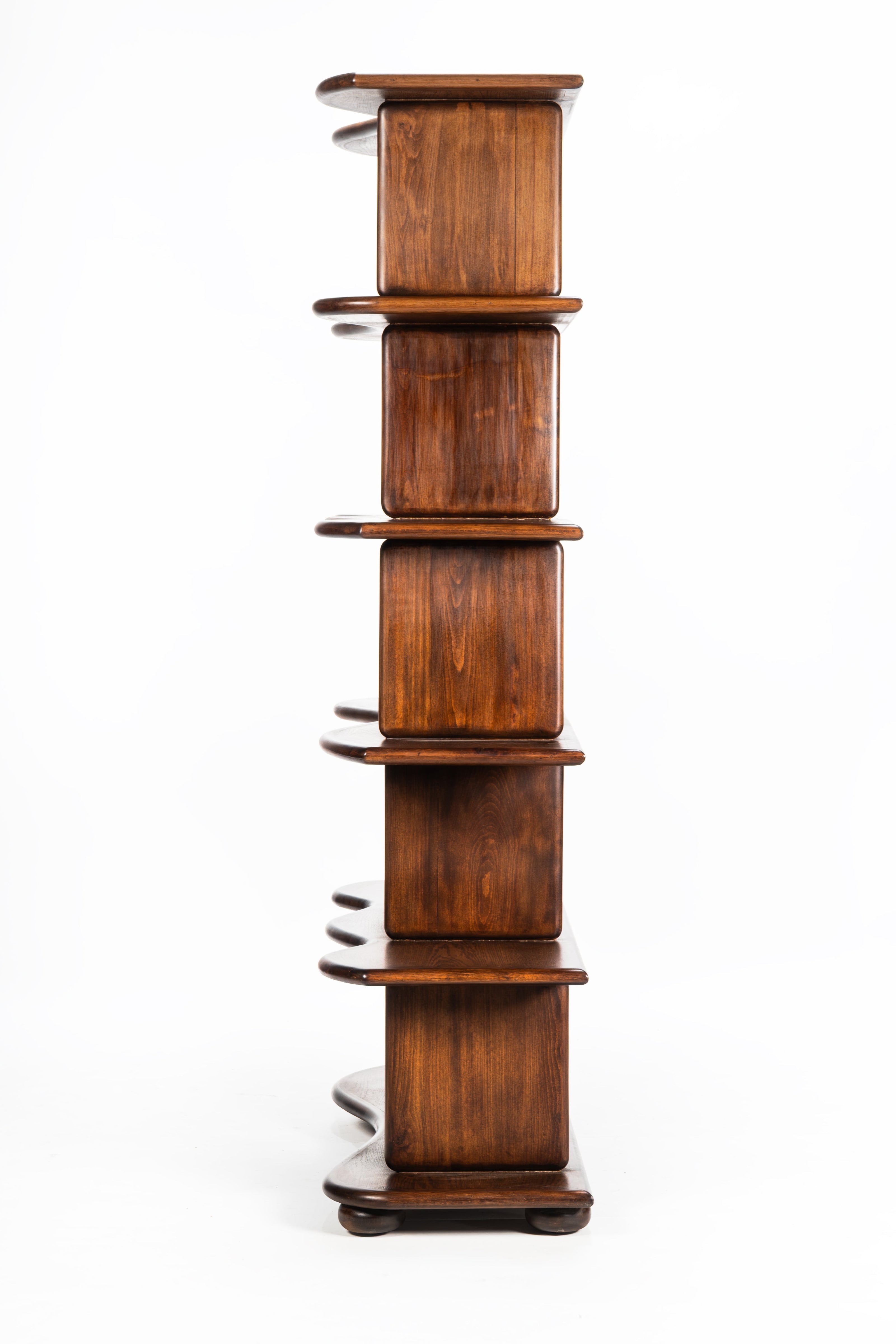 Wooden bookshelf with multiple shelves on a white background