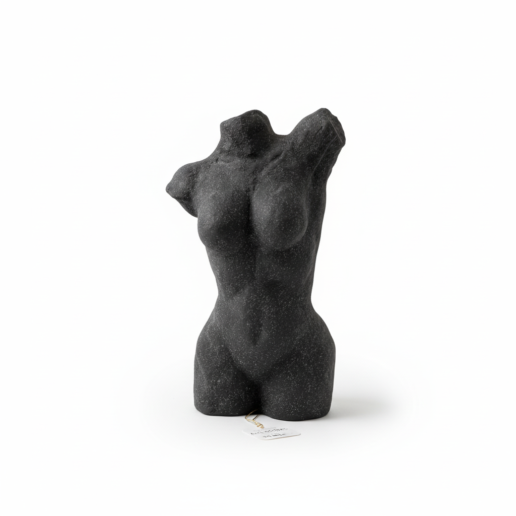 Black stone sculpture of a female torso on a white background