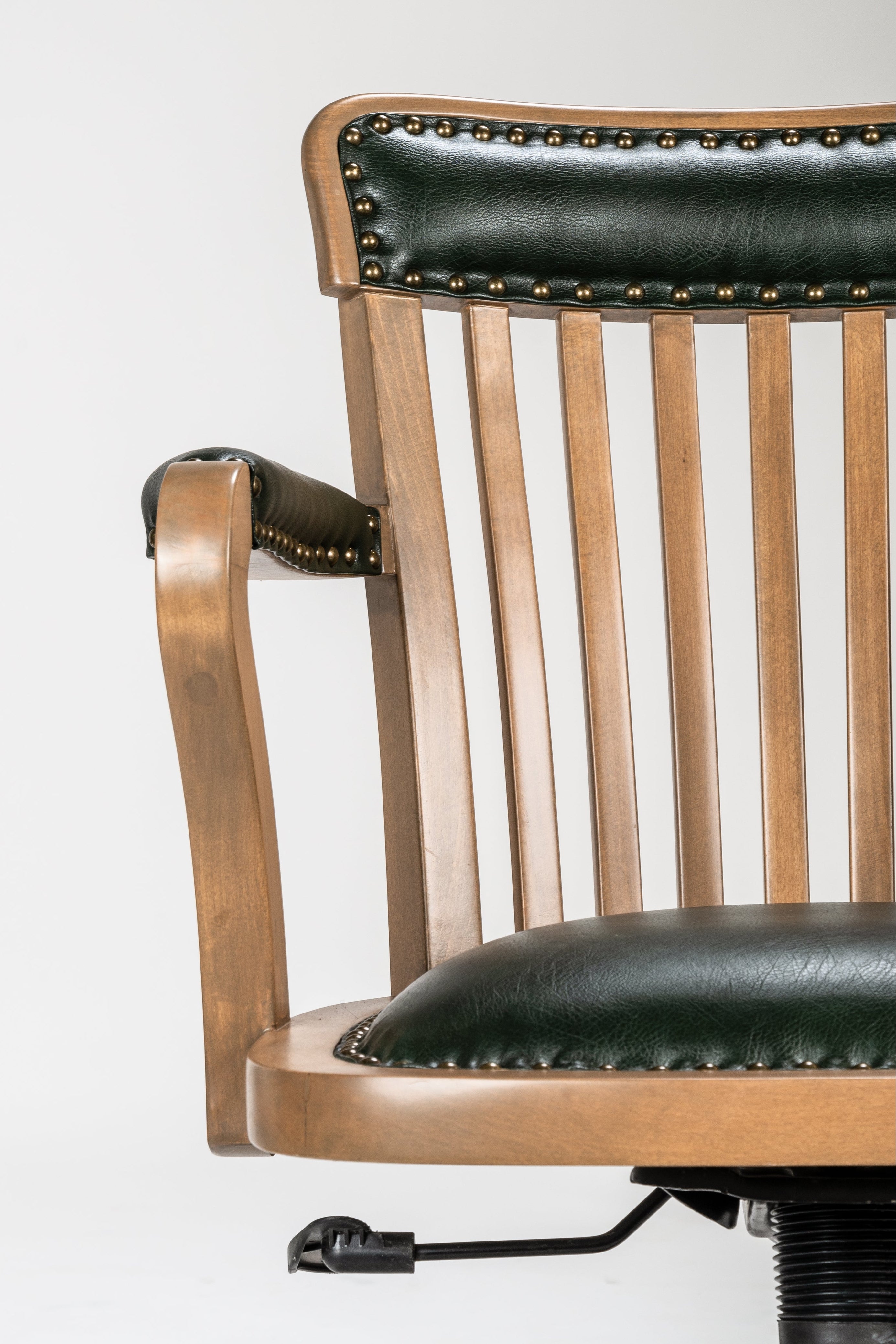 Wooden chair with black leather accents on a white background