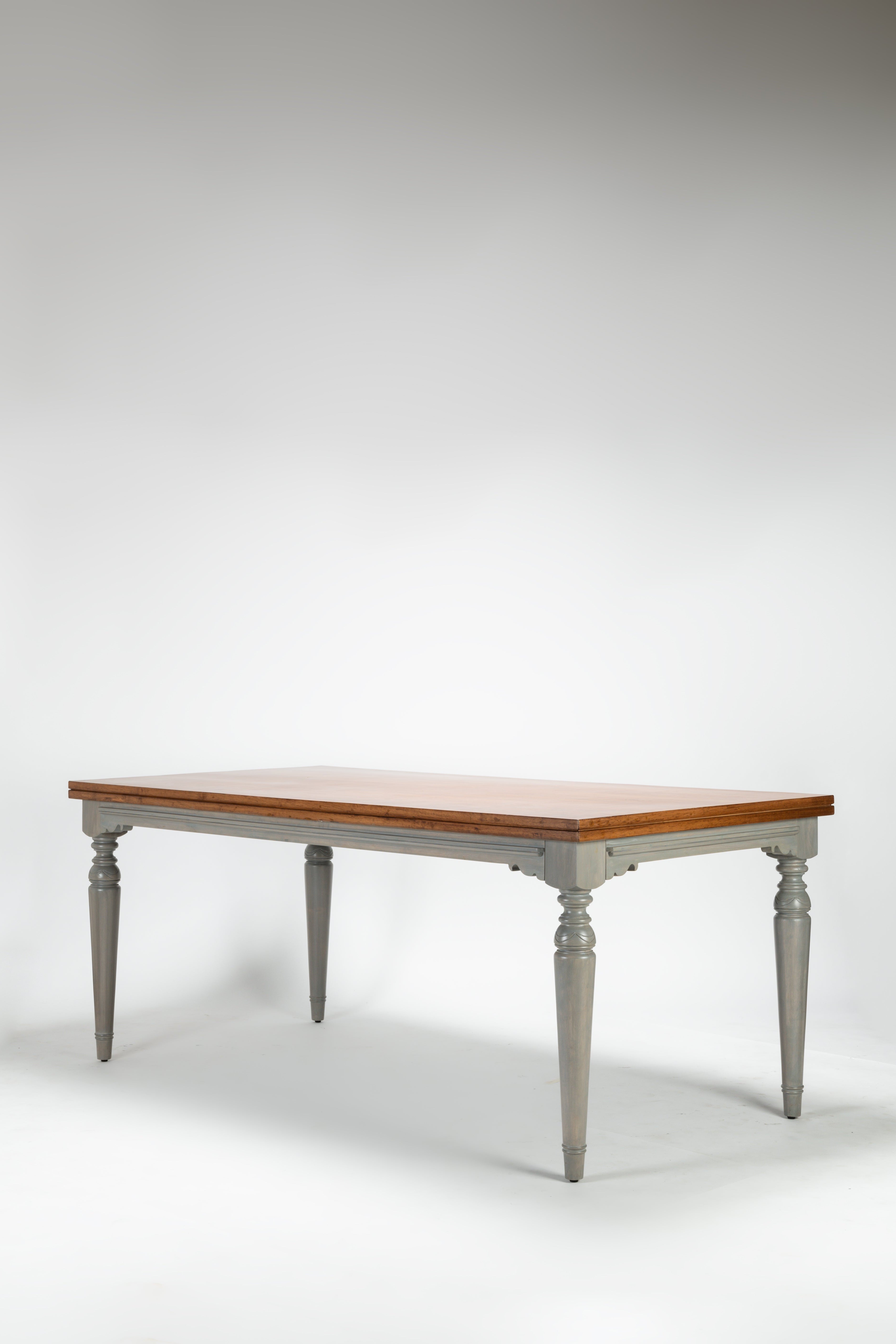 Wooden table with white legs on a gray background