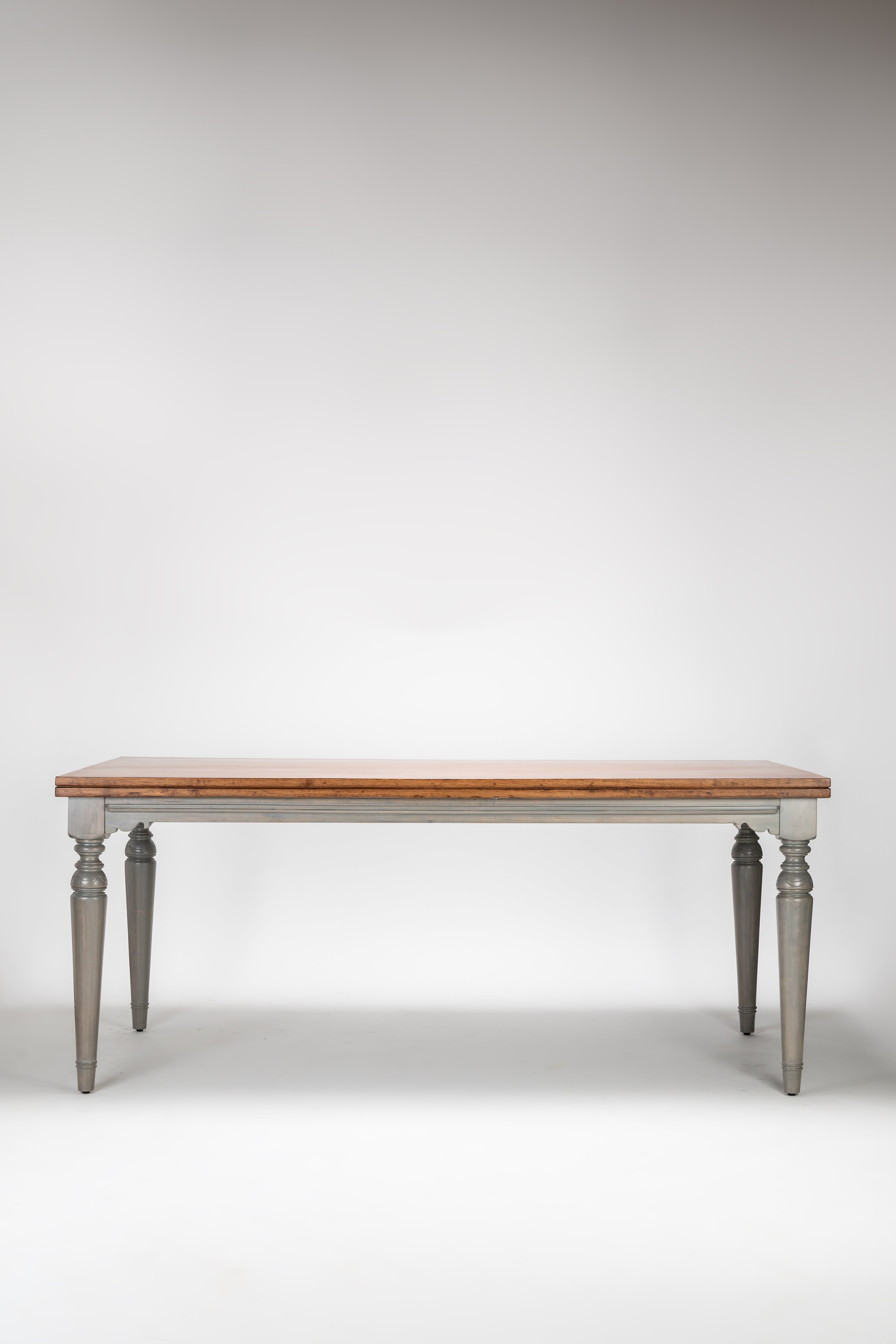 Wooden table with gray legs on a white background