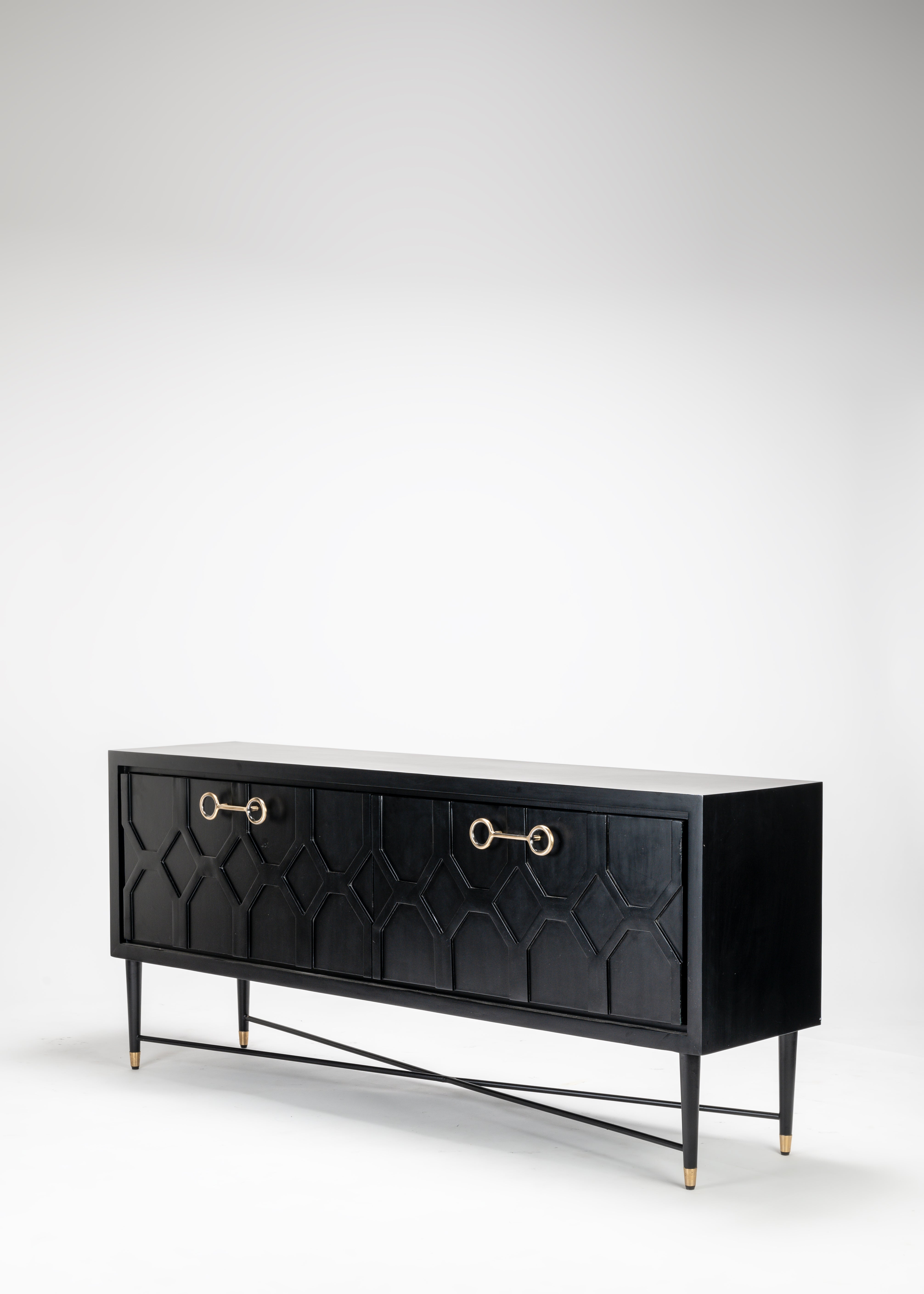Black sideboard with gold handles on a white background
