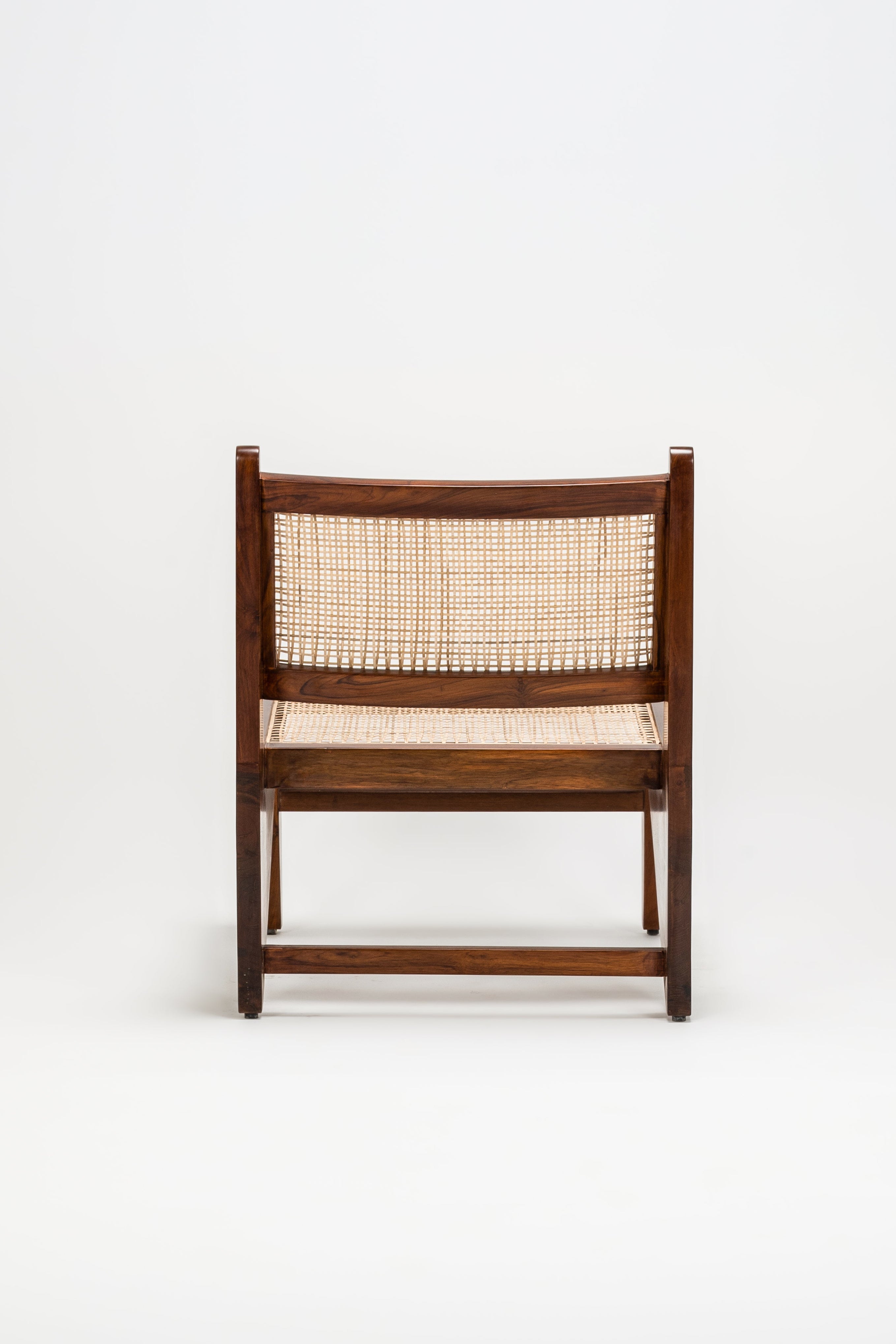 Wooden chair with woven backrest on a white background