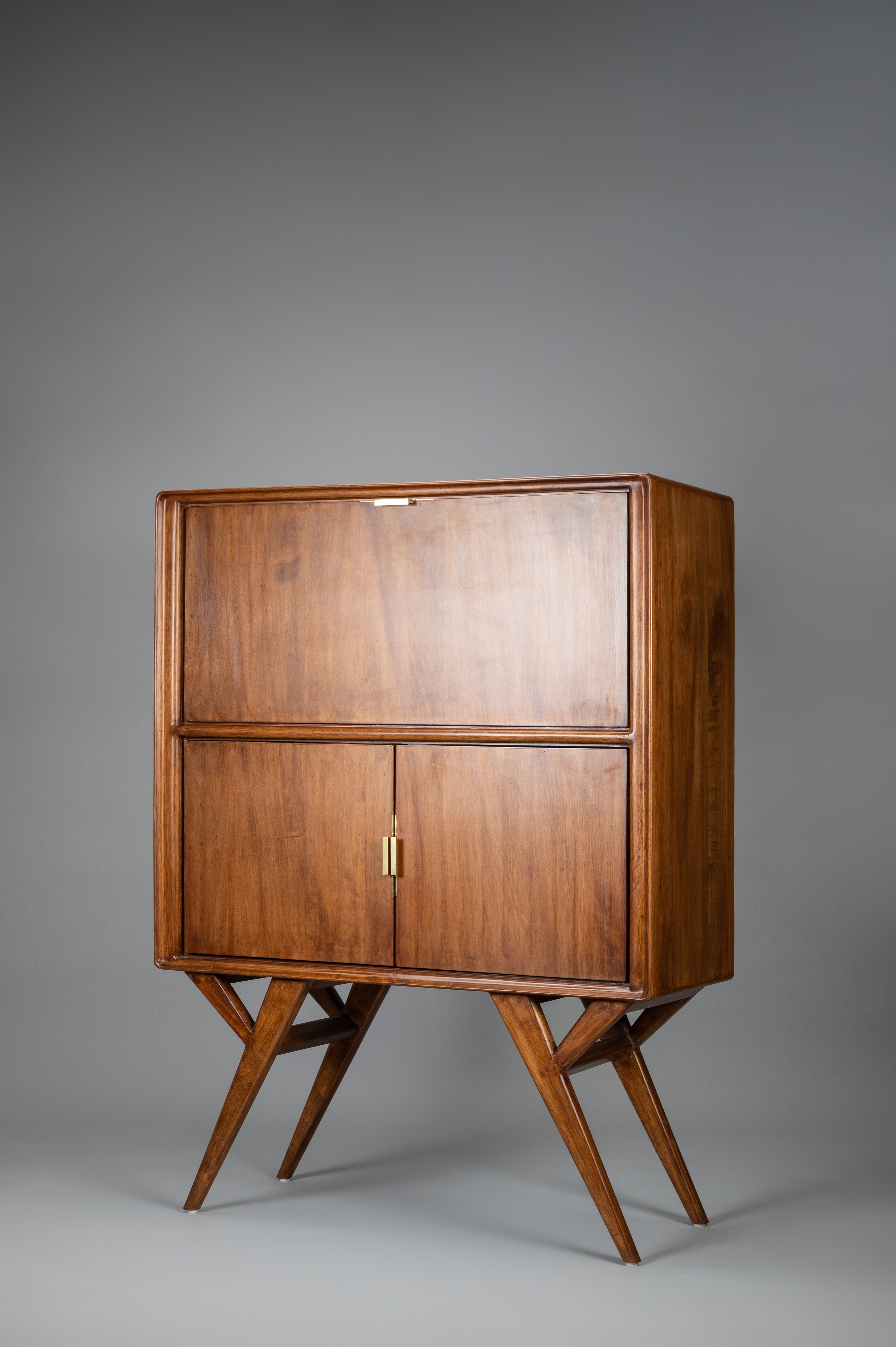 Wooden cabinet with two doors on a gray background