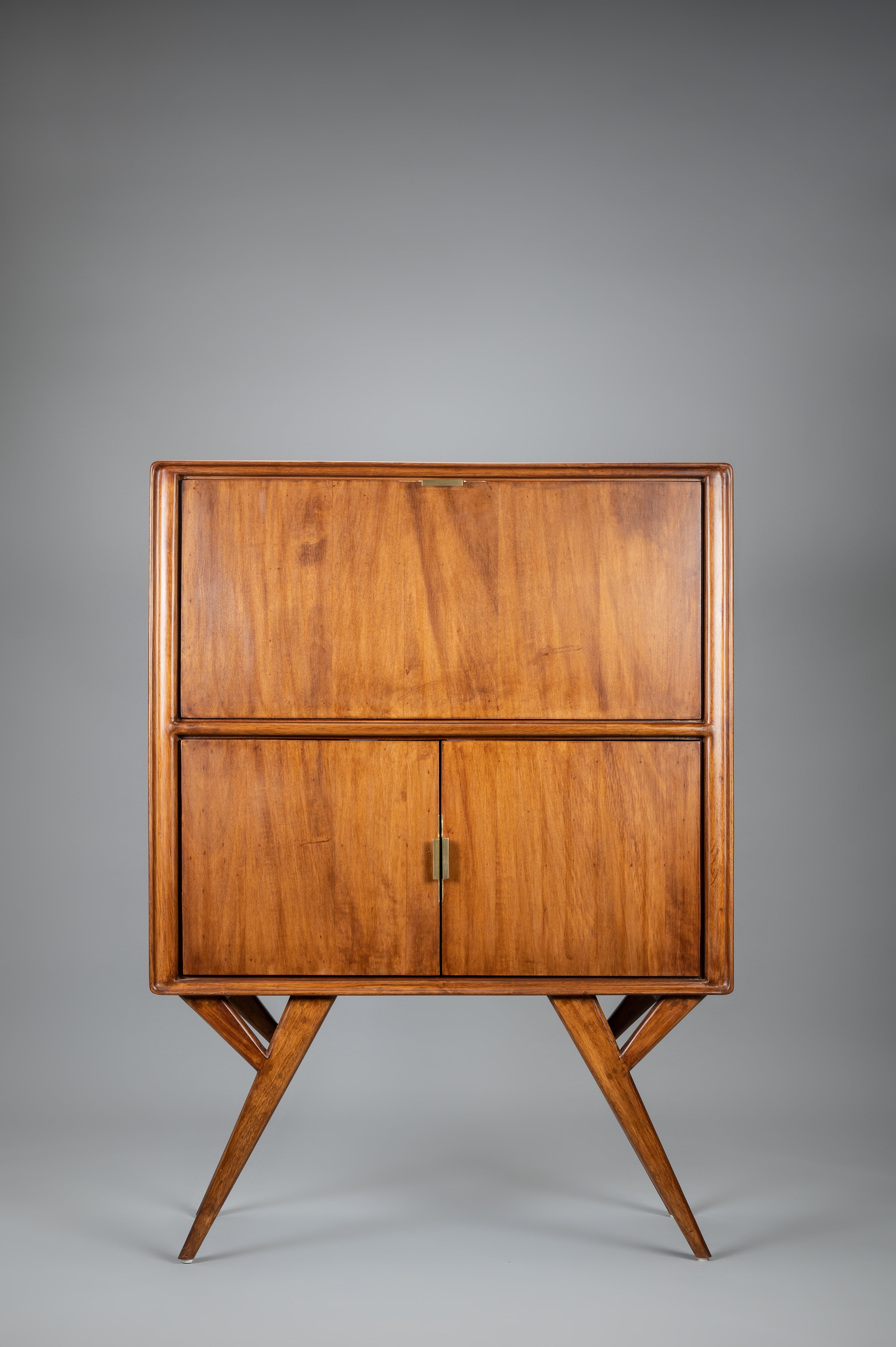 Wooden cabinet with two doors on a gray background