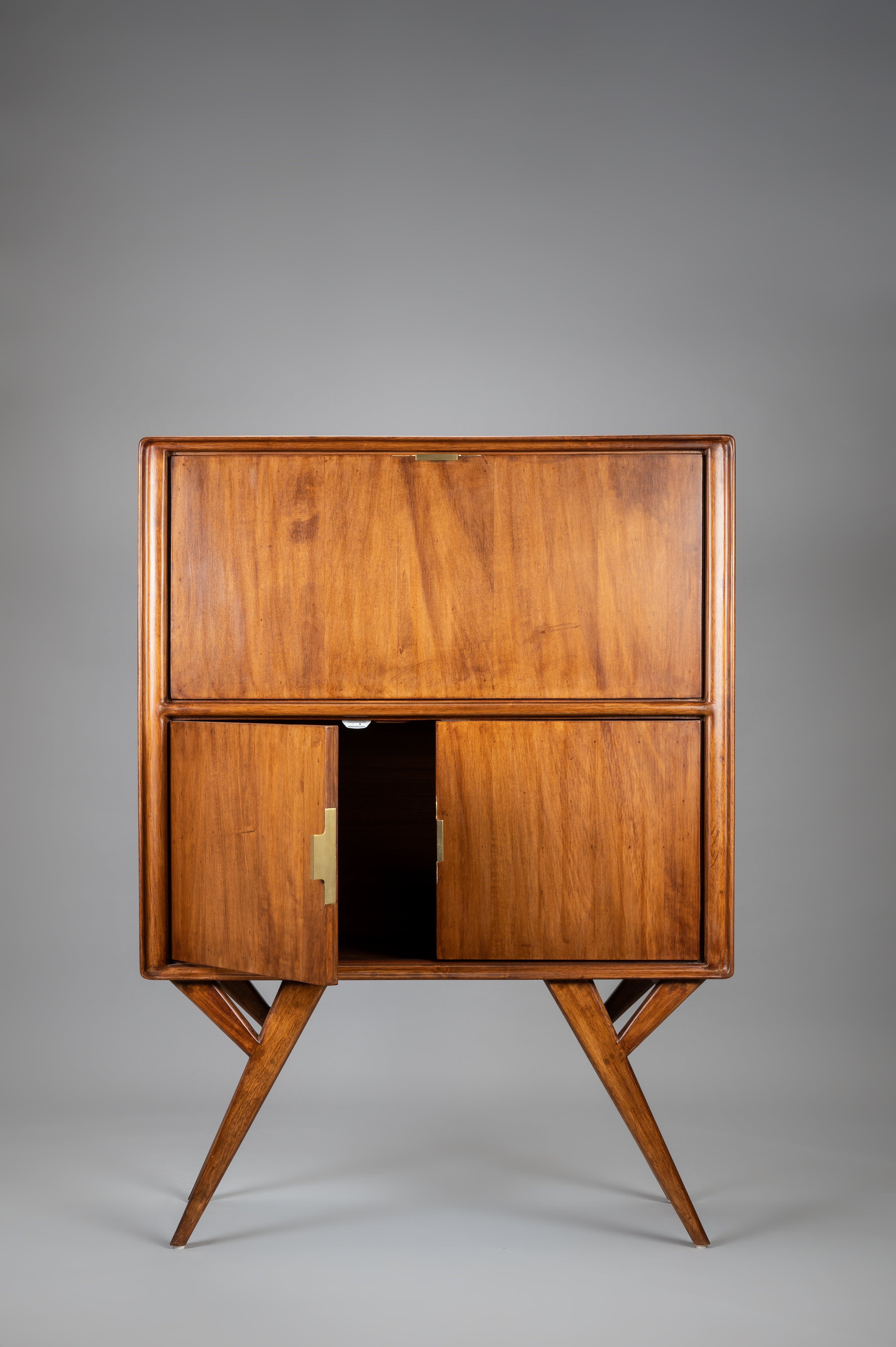 Wooden cabinet with two doors on a gray background