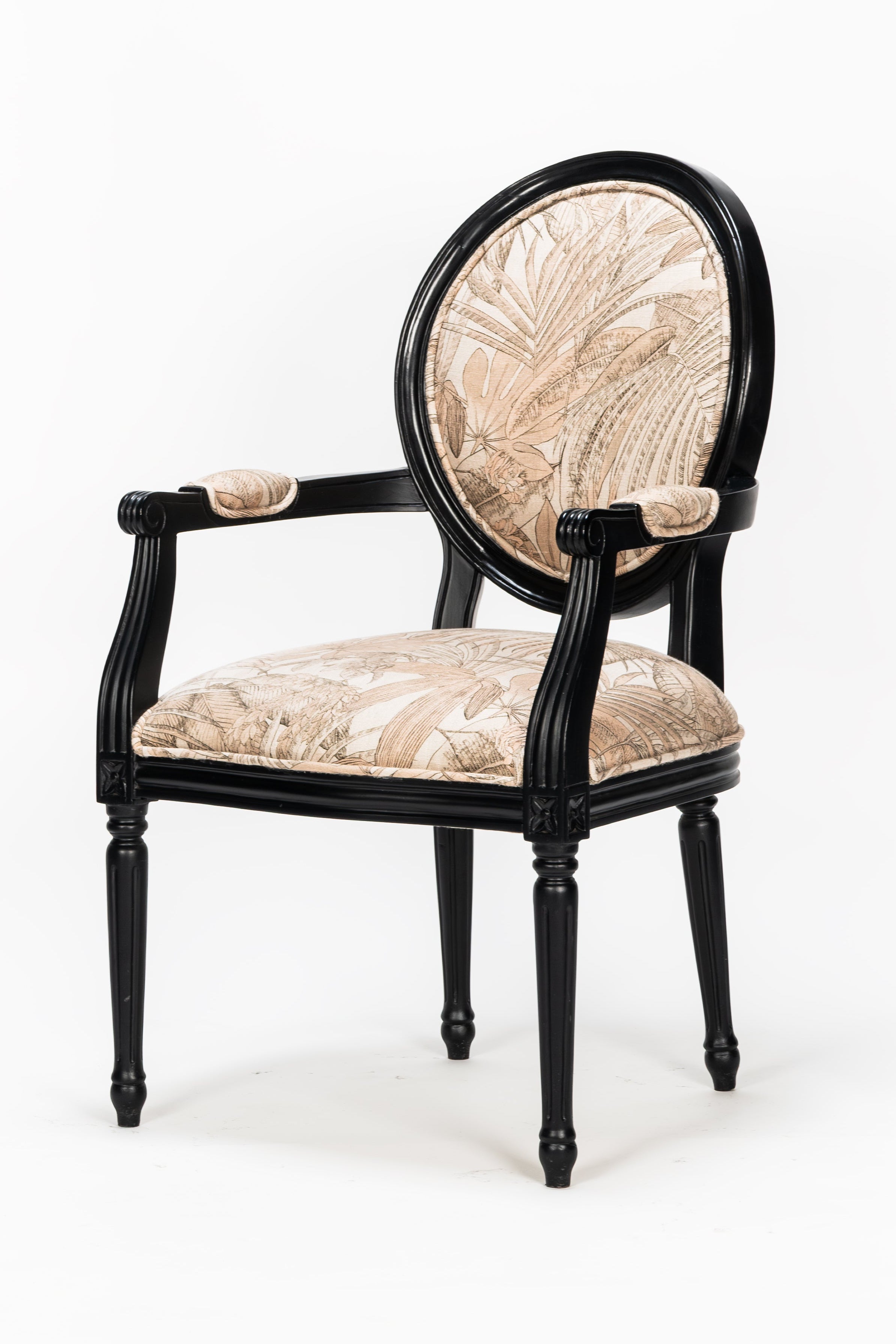 Decorative armchair with floral patterned seat and backrest on a white background