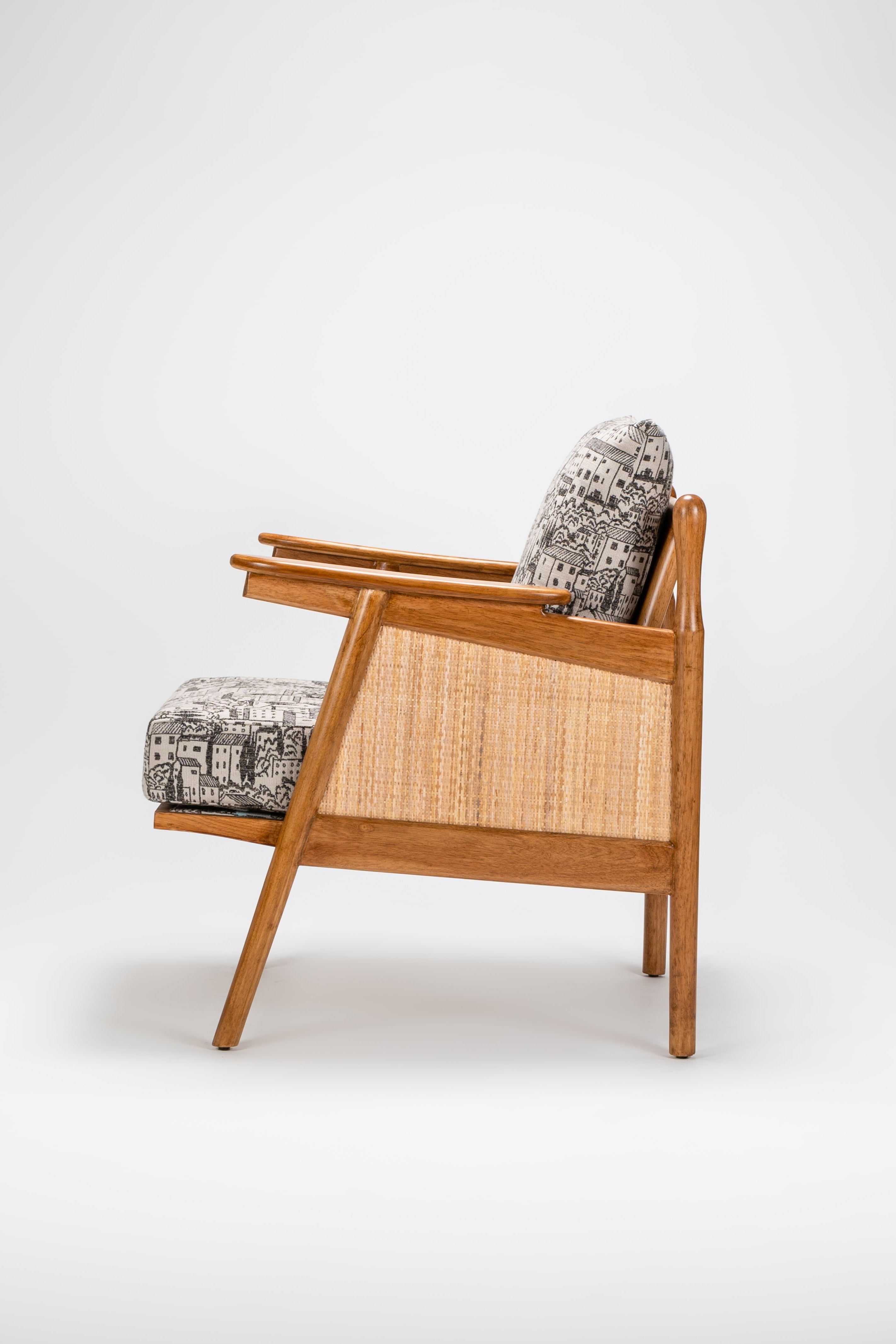 Wooden armchair with woven backrest on a white background