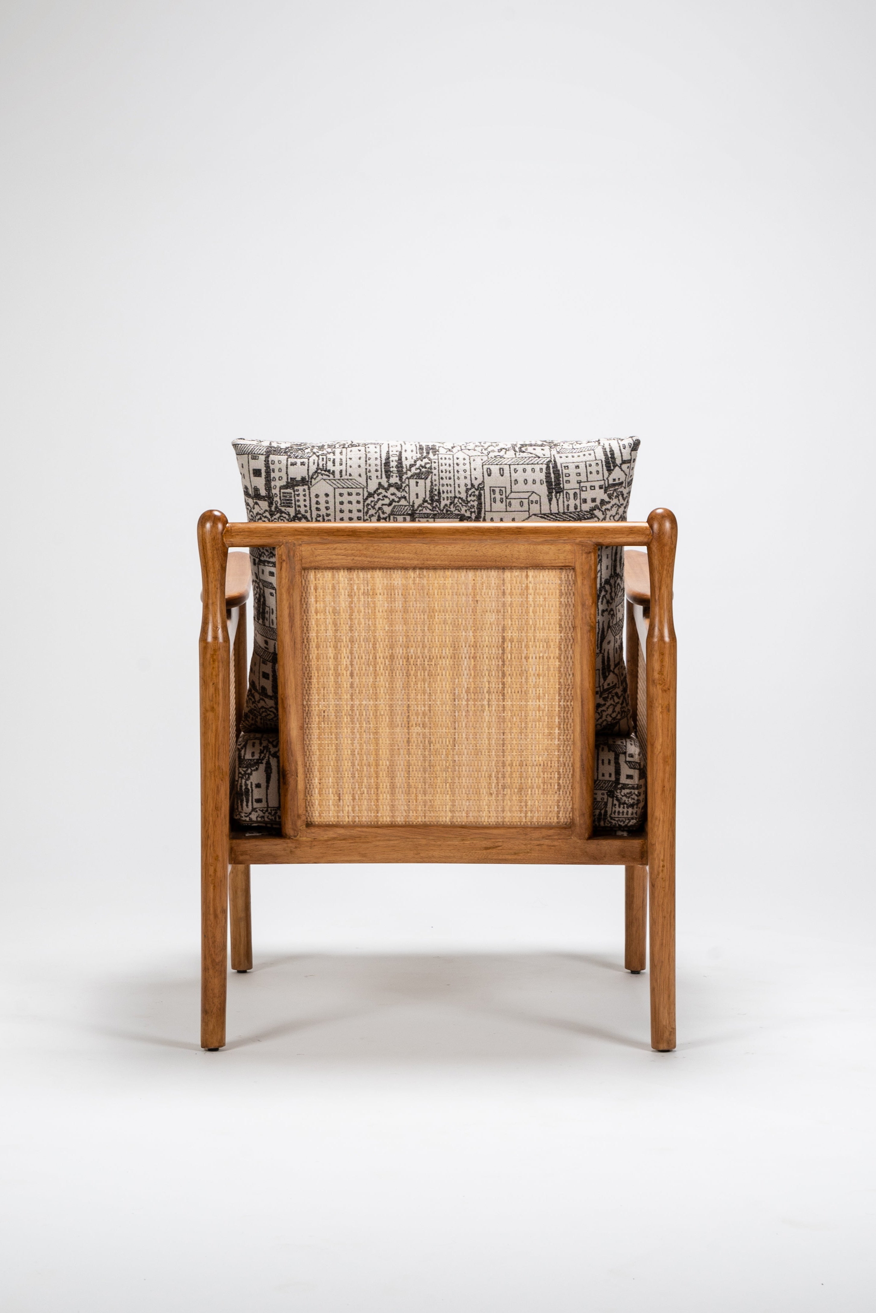 Wooden chair with woven backrest on a white background