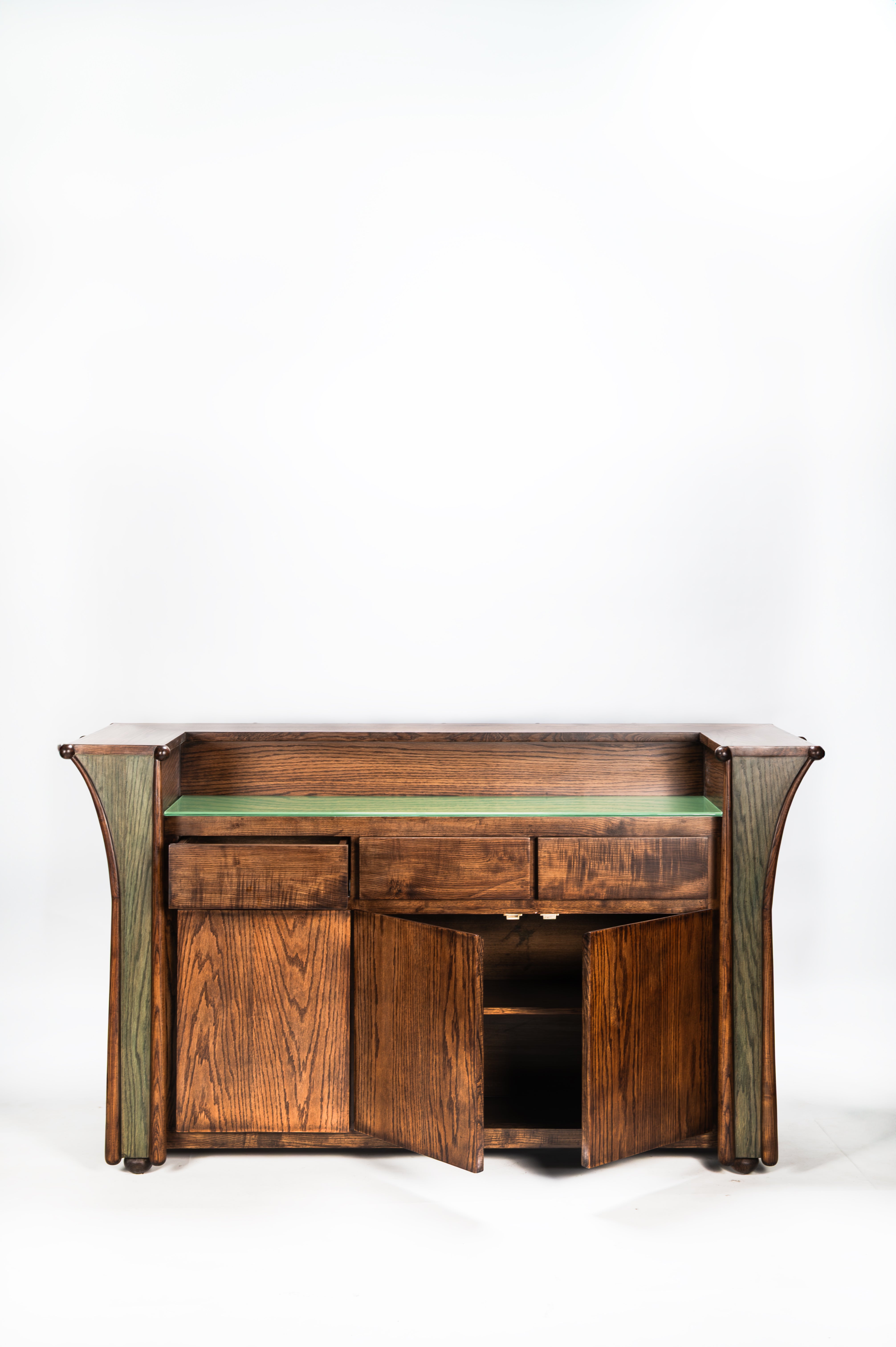 Wooden sideboard with green top on a white background
