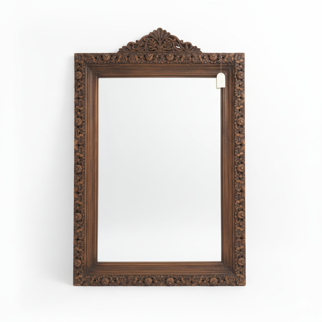 Decorative wooden mirror frame on a white background