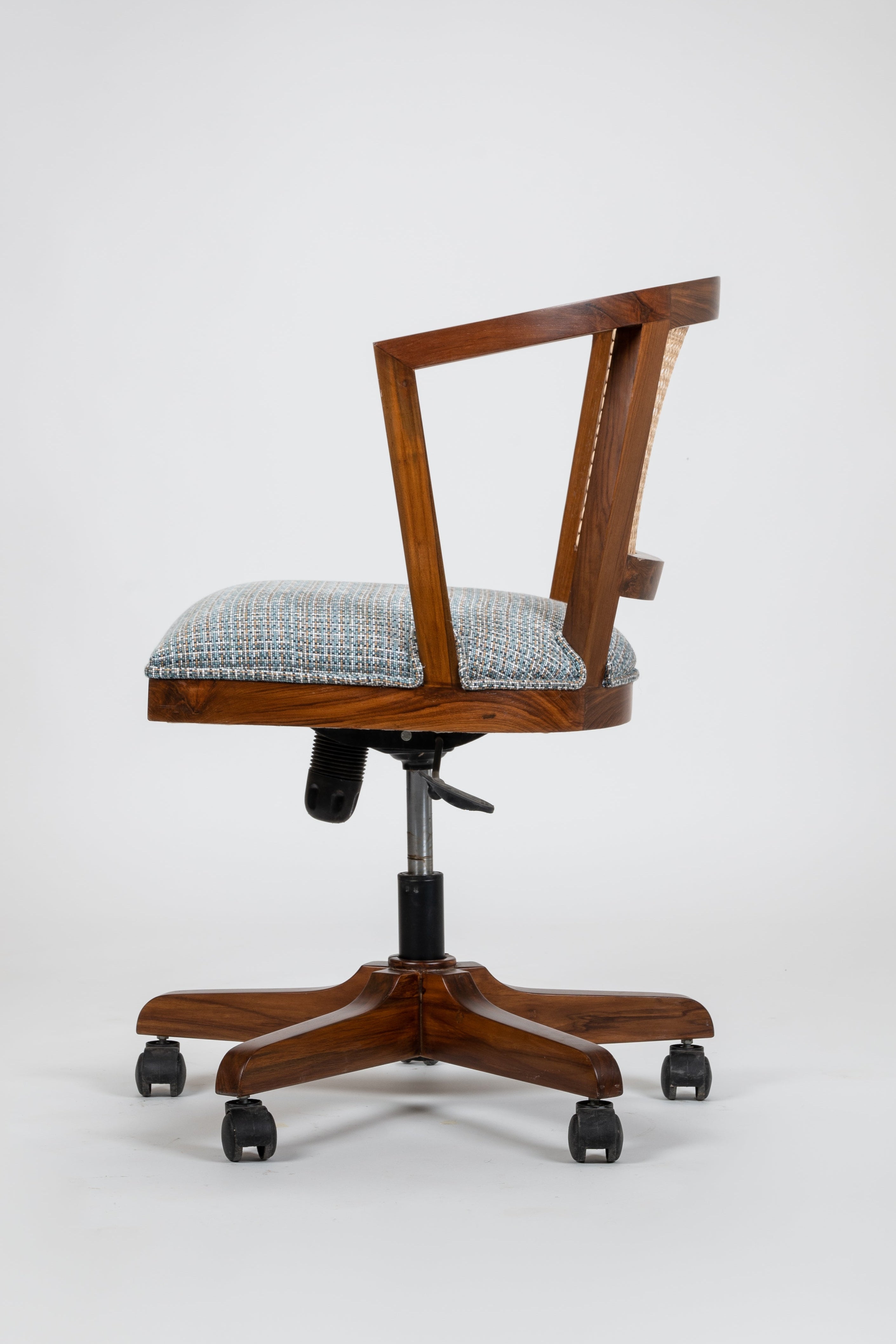 Wooden office chair with a checkered cushion on a white background