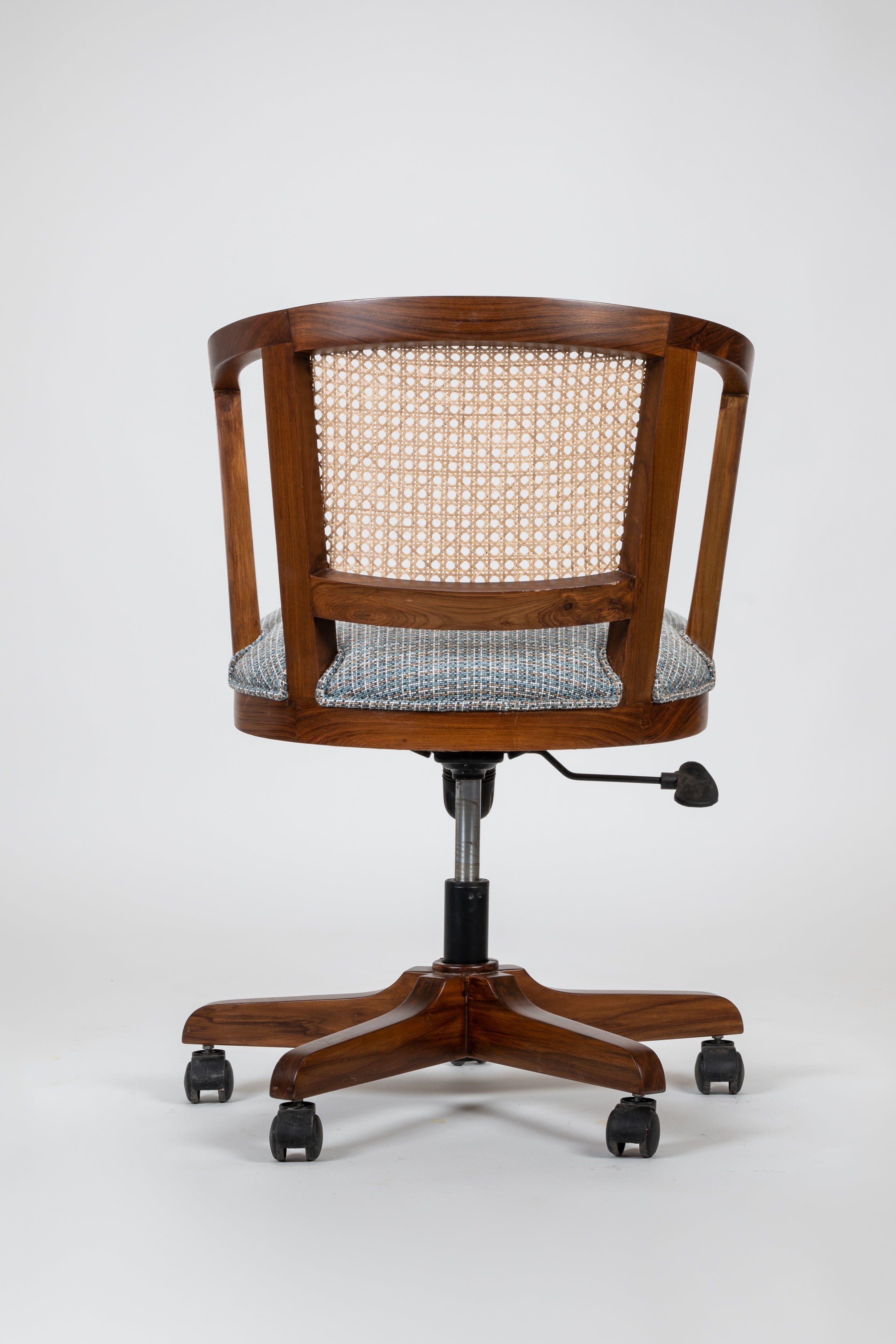 Wooden office chair with wicker backrest on a white background