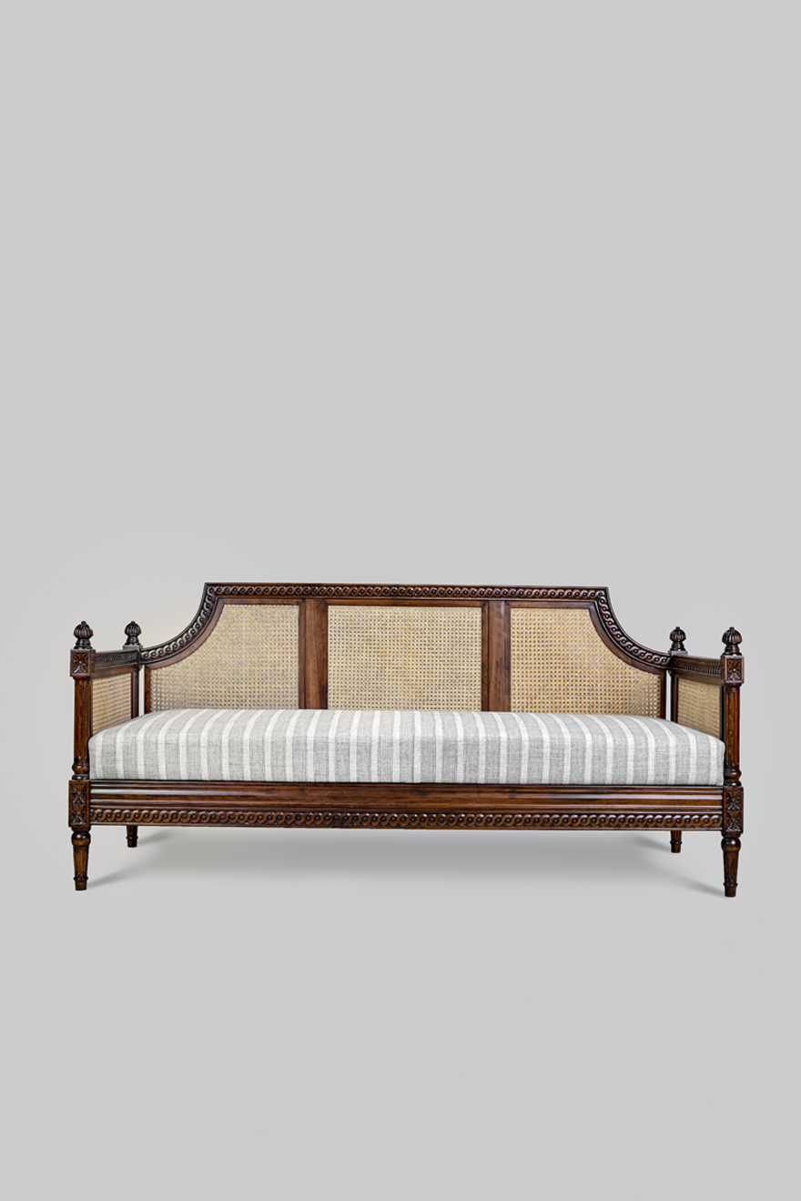 Wooden bed with white bedding on a gray background