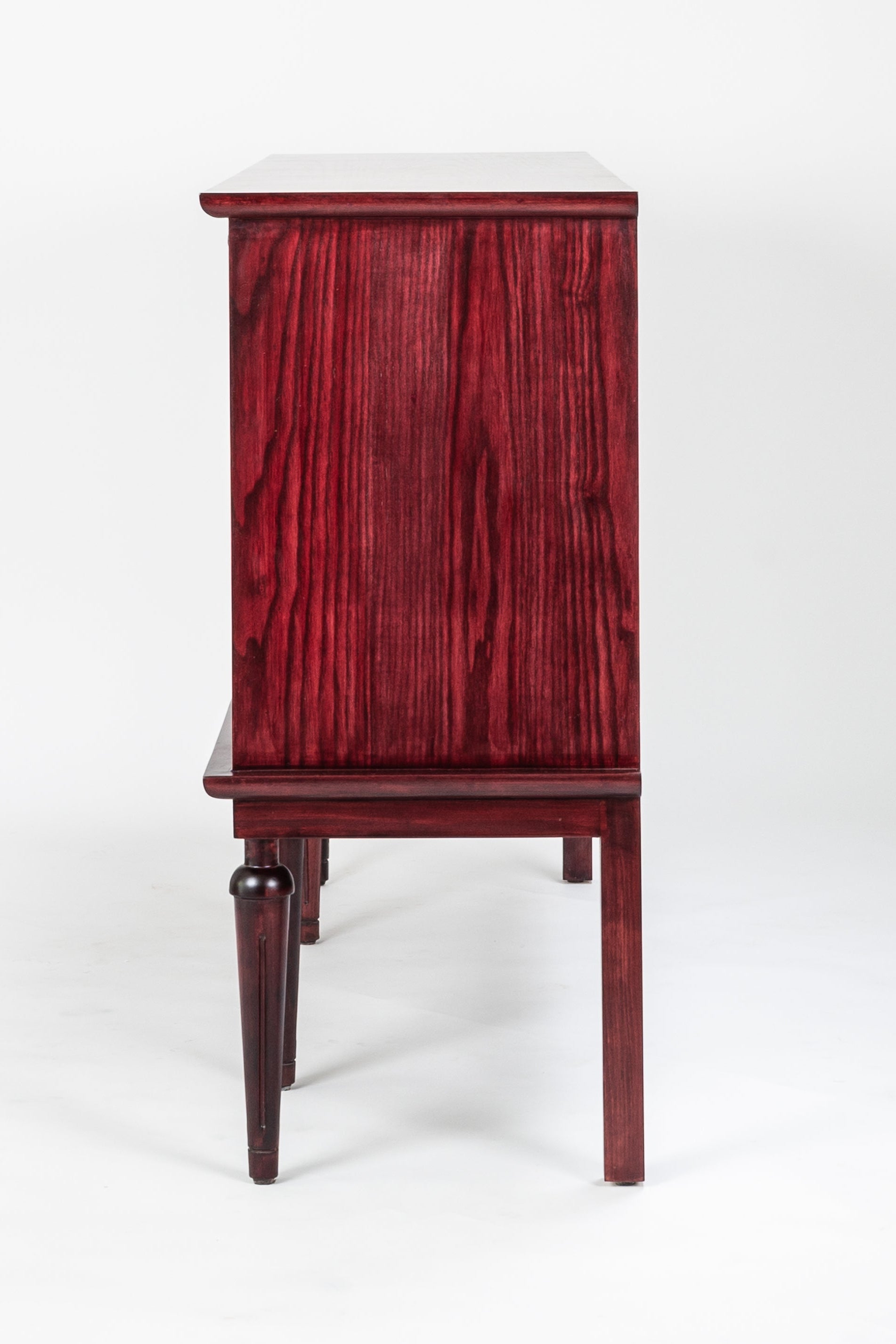 Wooden cabinet with a red-brown finish on a white background