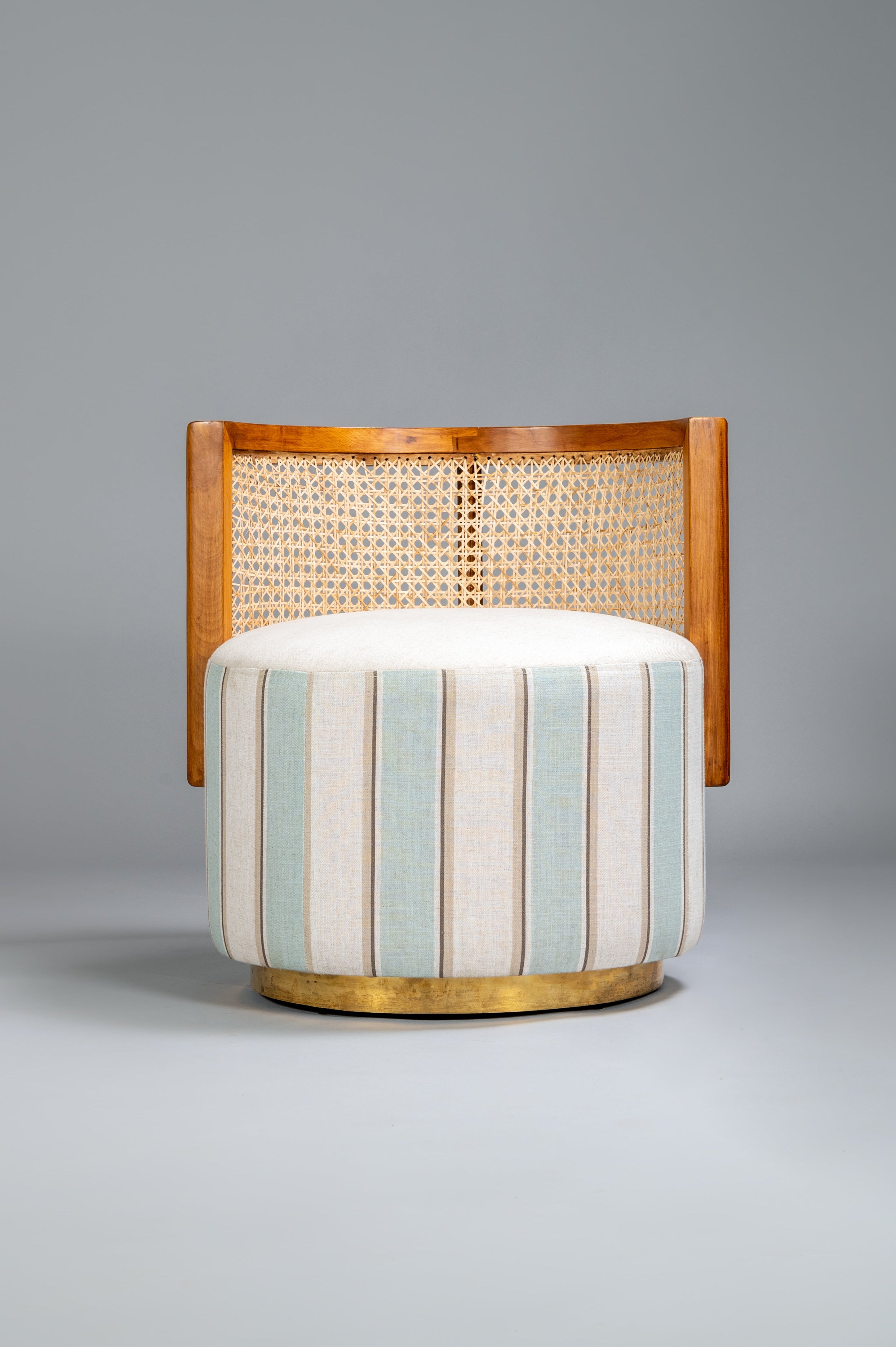 Chair with striped cushion on a gray background