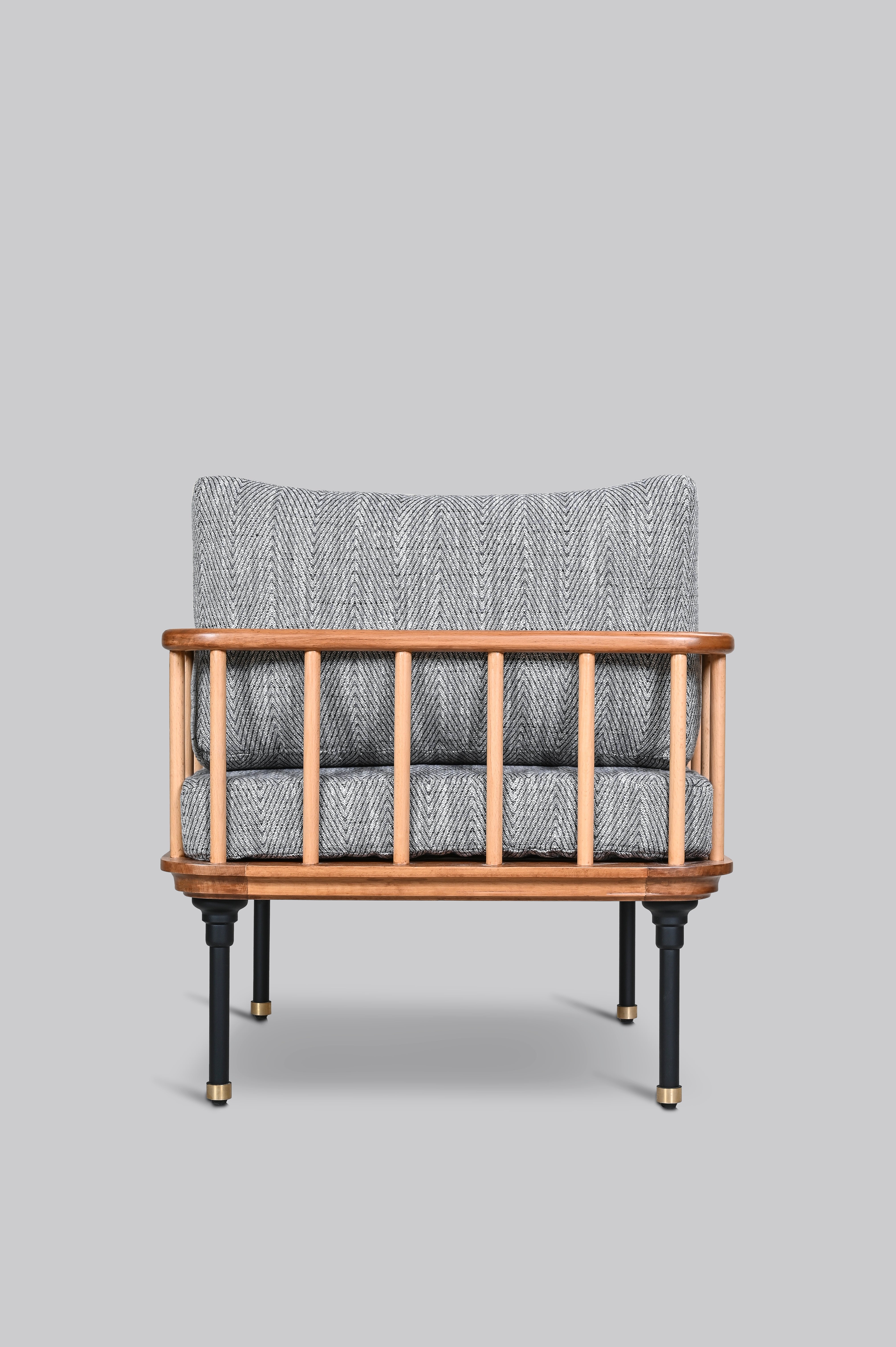 Chair with woven backrest and wooden frame on a gray background