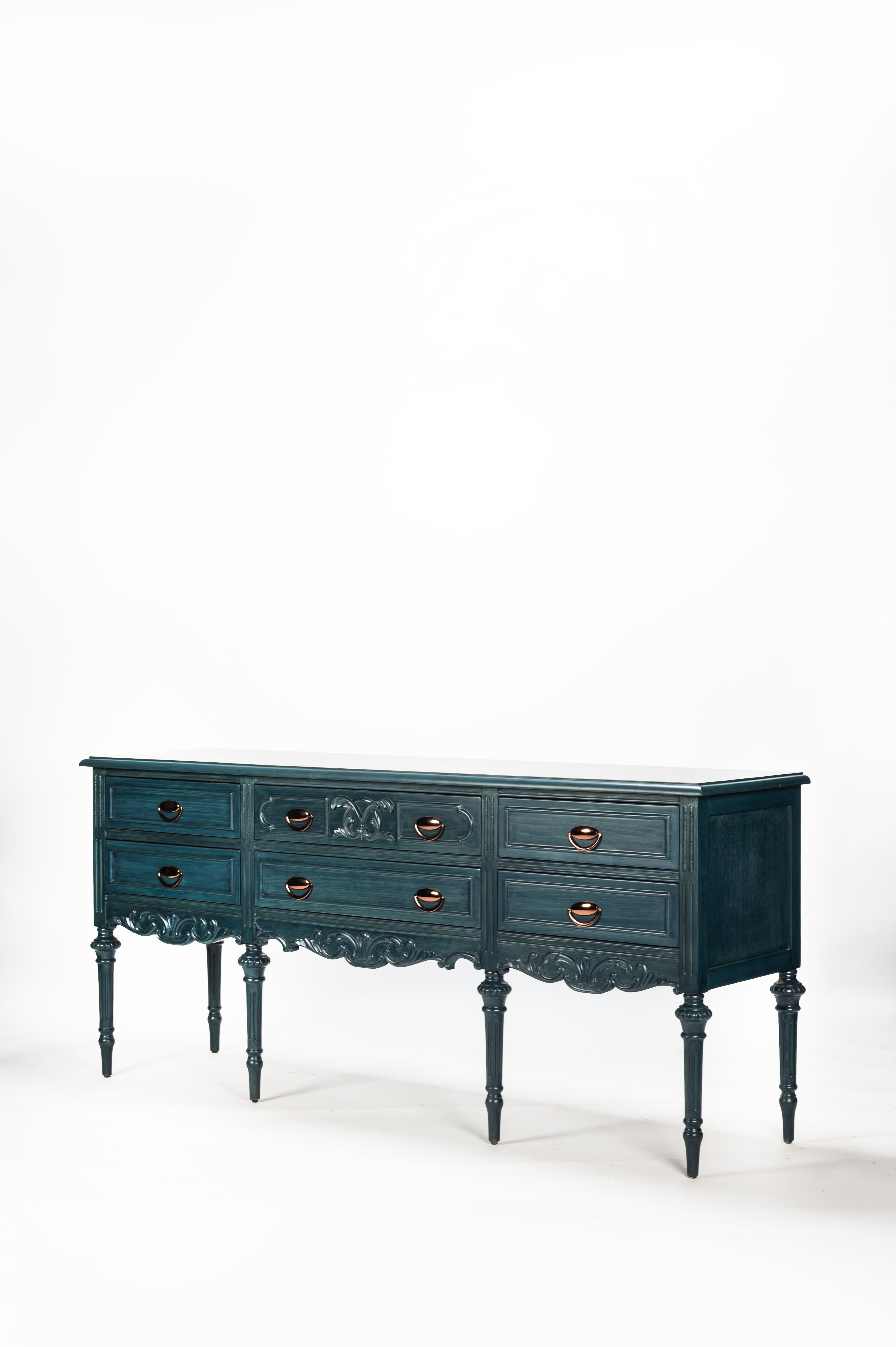 Dark blue dresser with decorative legs on a white background